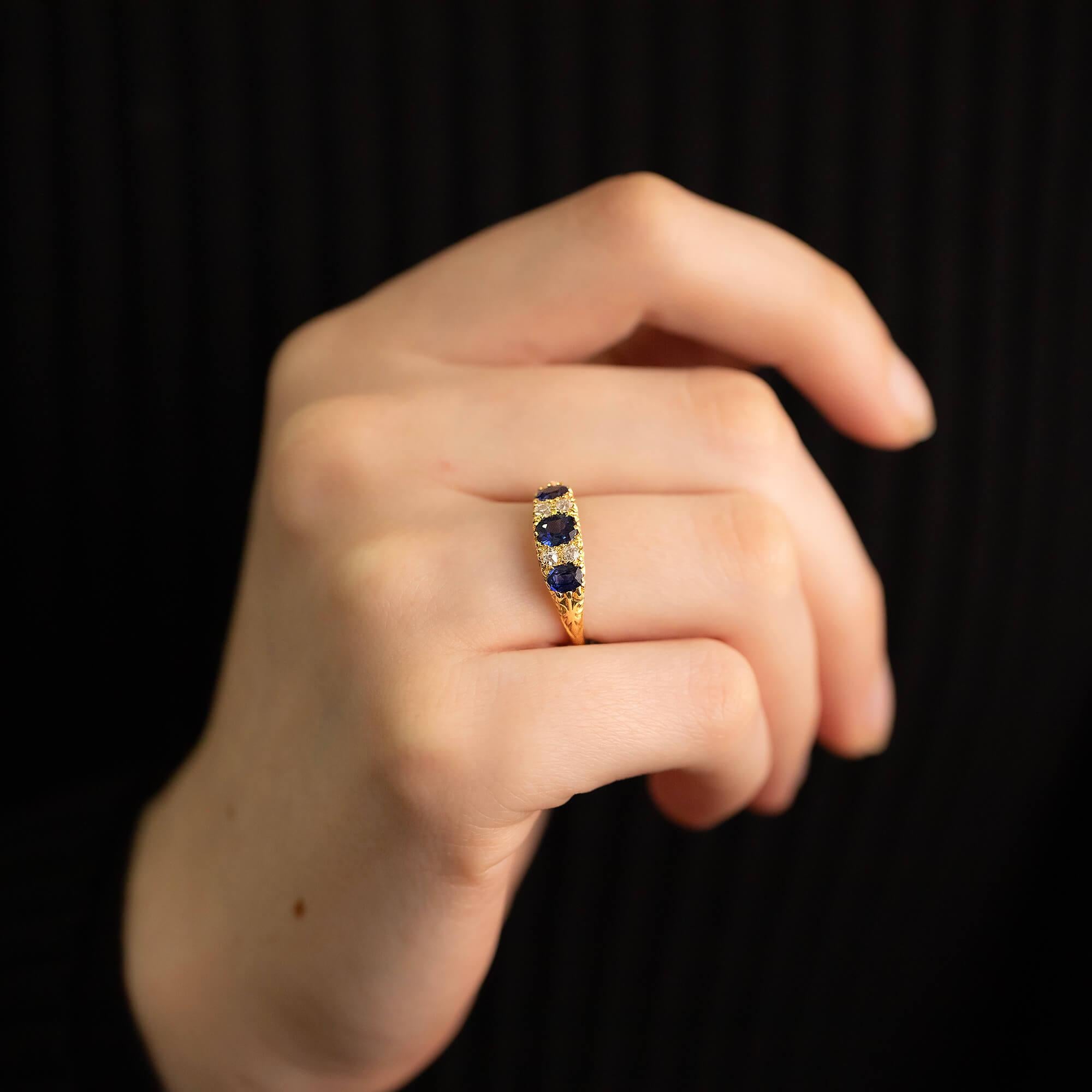 Victorian sapphire and diamond half hoop ring – Hallmarked with maker mark J.W.B
The half hoop is a lovely style, sitting across the top of the finger, making the most of this space by filling it with diamonds. These gems are set in a carved mount,