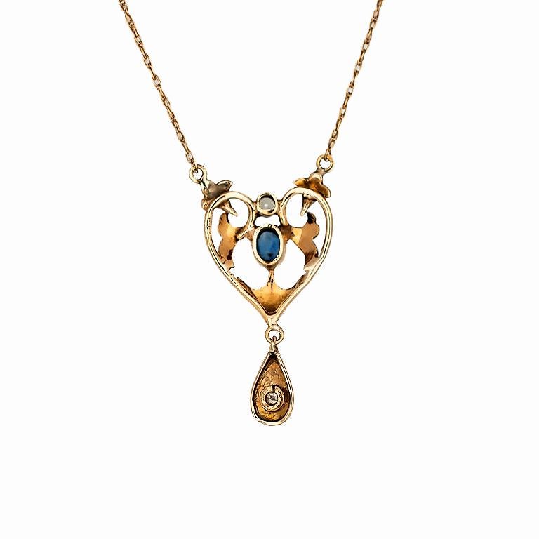 This Victorian pendant consist of the following.  The piece is forged out of white and yellow gold and weighs 4.6 grams .   The star of this pendant is the Oval Sapphire bezel set and measures 5.44mm X 4.29mm.  The center stone is accompanied by two