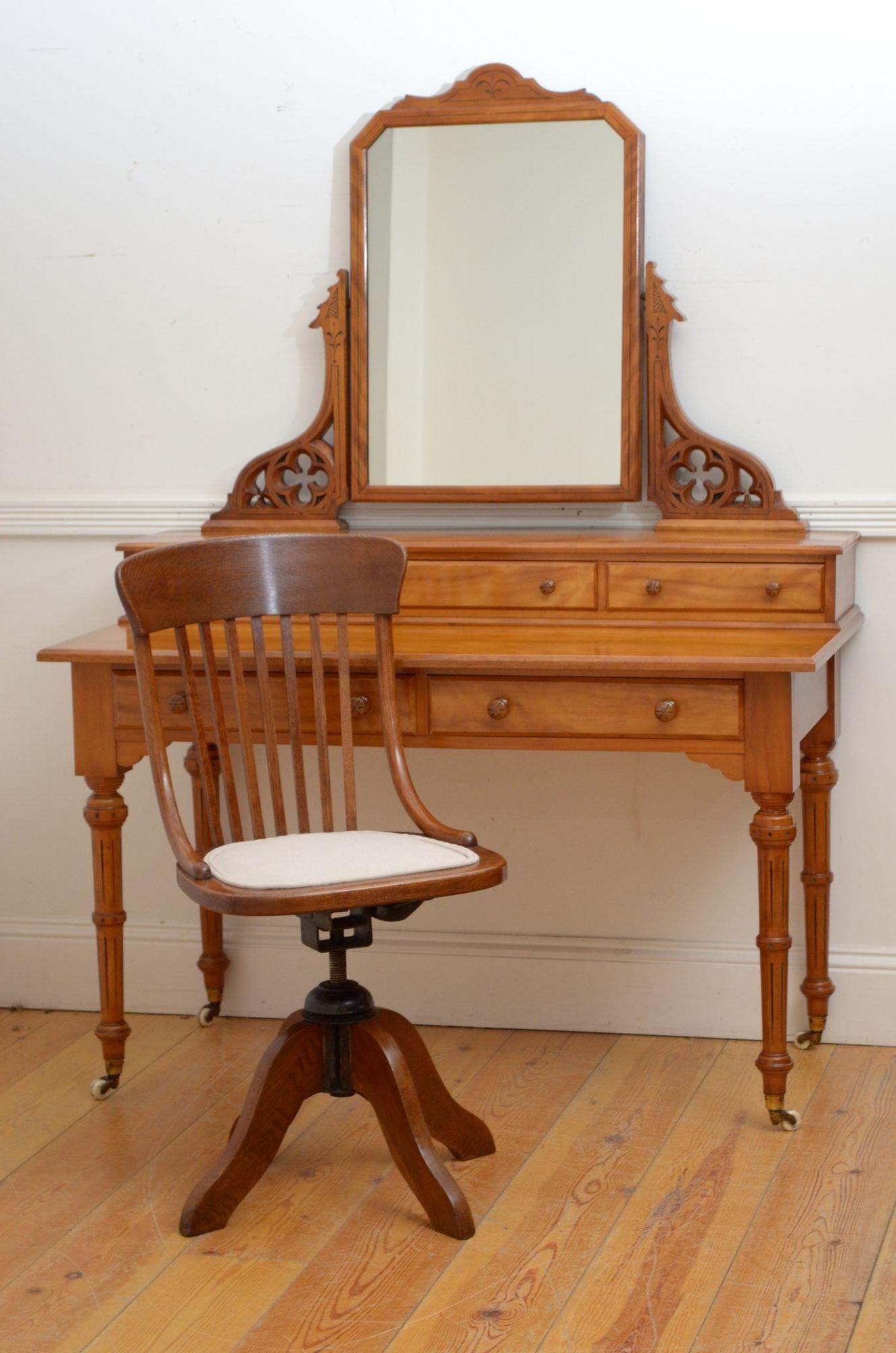 K0278 Fine quality Victorian Gothic Revival satin birch dressing table, having original mirror in moulded frame on finely carved with Gothic motifs uprights terminating in three oak lined jewellery drawers and attractive top with two oak line frieze