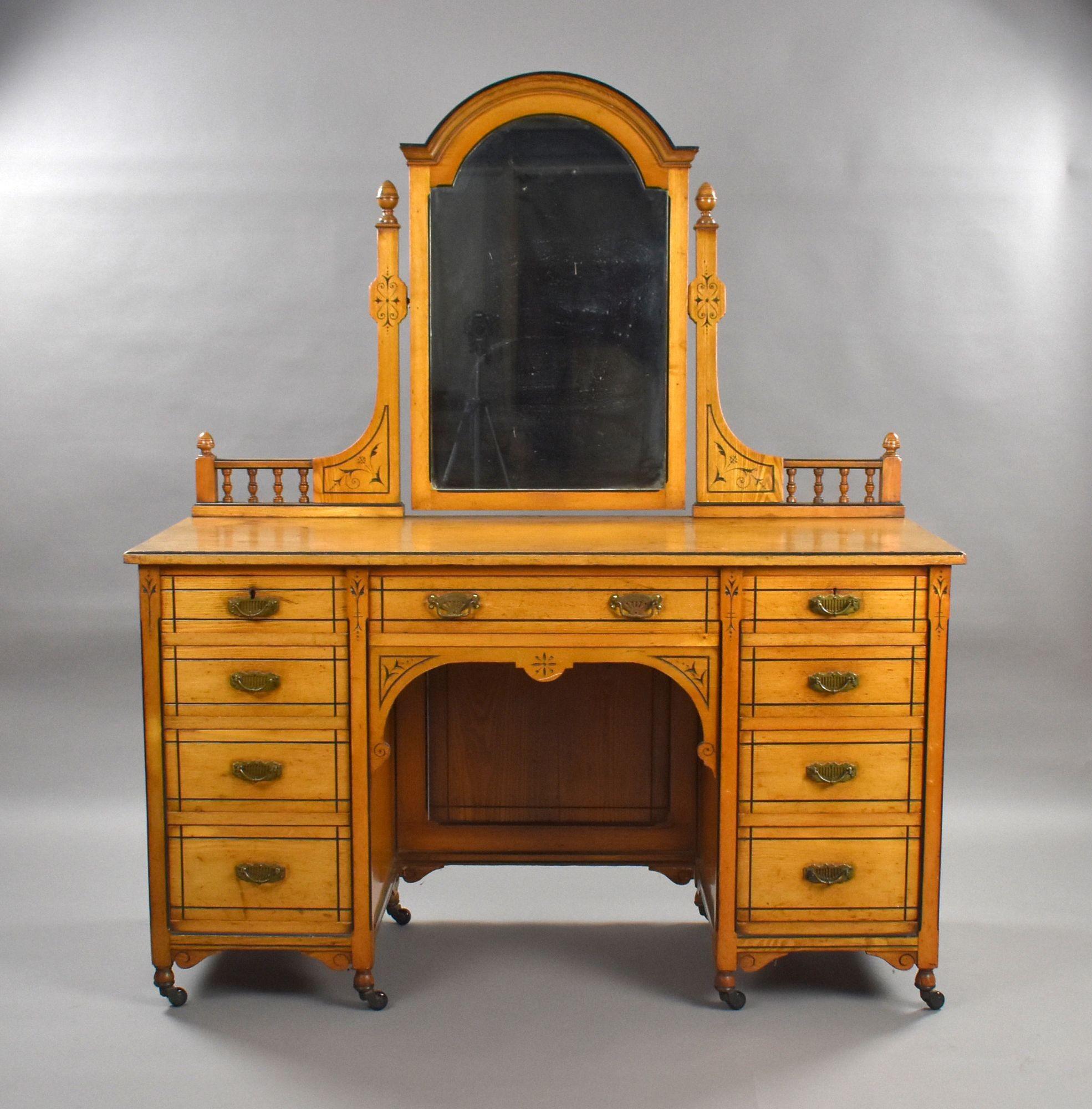 Victorian Satin Walnut & Ebonised Dressing Table with Arched Mirror
Item Code: 1382
A handsome late Victorian dressing table crafted in beautifully figured satin walnut, enriched with ebonised line inlay and delicate engraved floral motifs. The