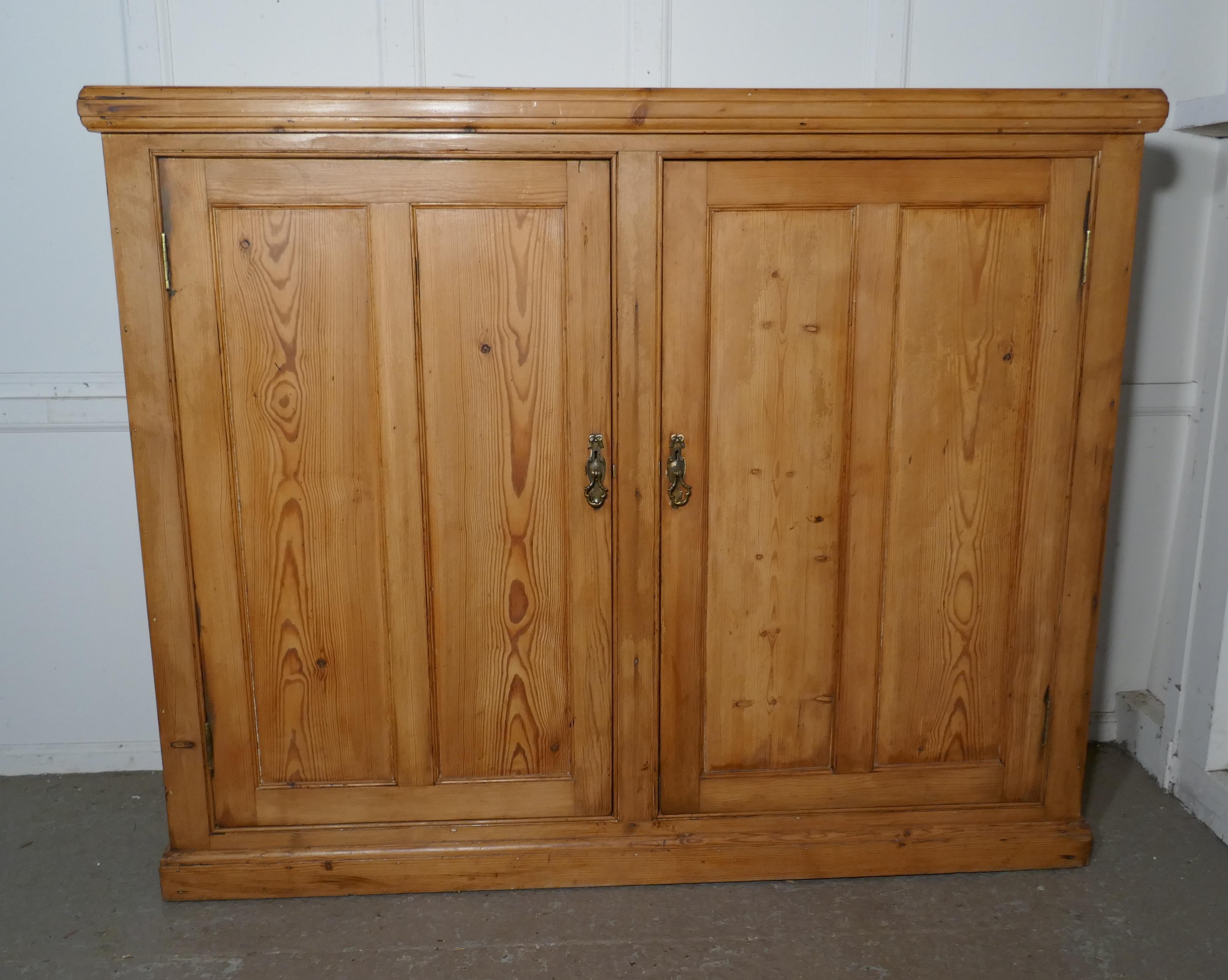 Victorian school book cupboard, kitchen store cupboard 

This is a Victorian piece made in 1” thick solid pine, it has two, two panelled doors, inside it is divided by 3 full length fixed shelves. The top of the dresser has thick moulded top and
