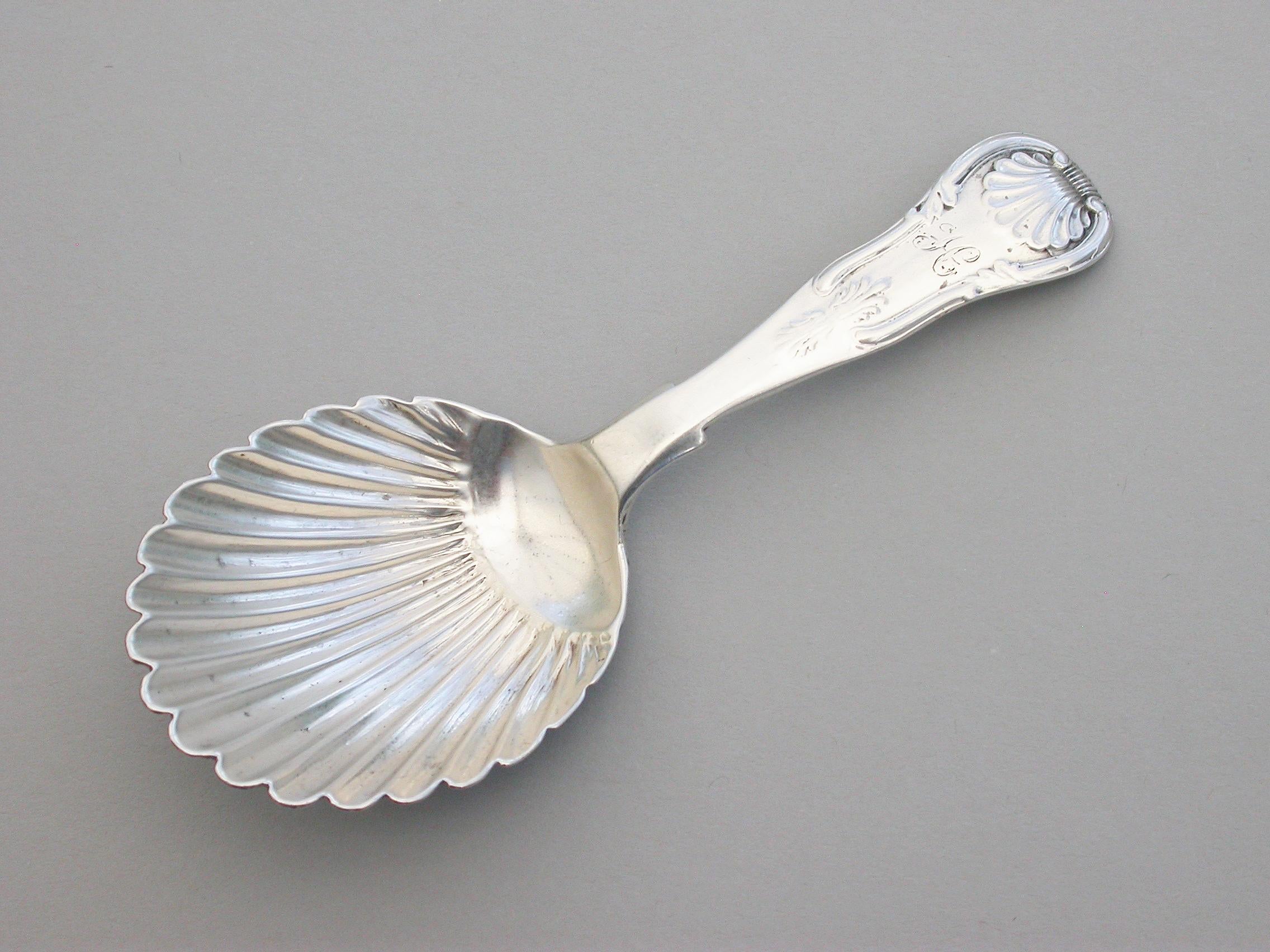 A good Victorian Scottish silver caddy spoon with part fluted oval bowl and single-struck Kings pattern handle.

By J & W Marshall, Edinburgh, 1852 

Weight 20.00 grams (0.64 troy ounces).