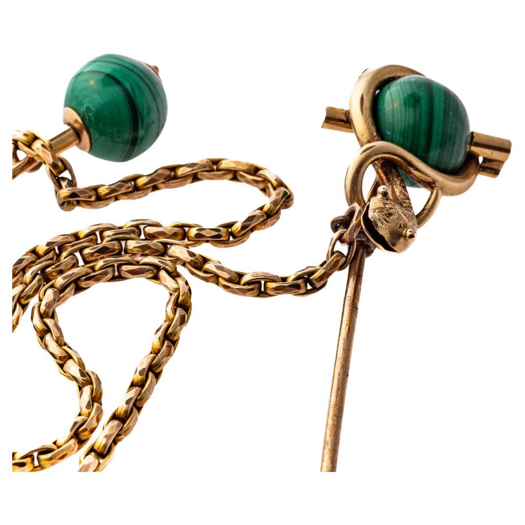 The unique vibrant green color of malachite is beautiful set in the gold or heavily gold cased setting of these cloak pins. Malachite has natural back stripes in the stone. When gold cased jewelry is heavily cased it tests as gold making it