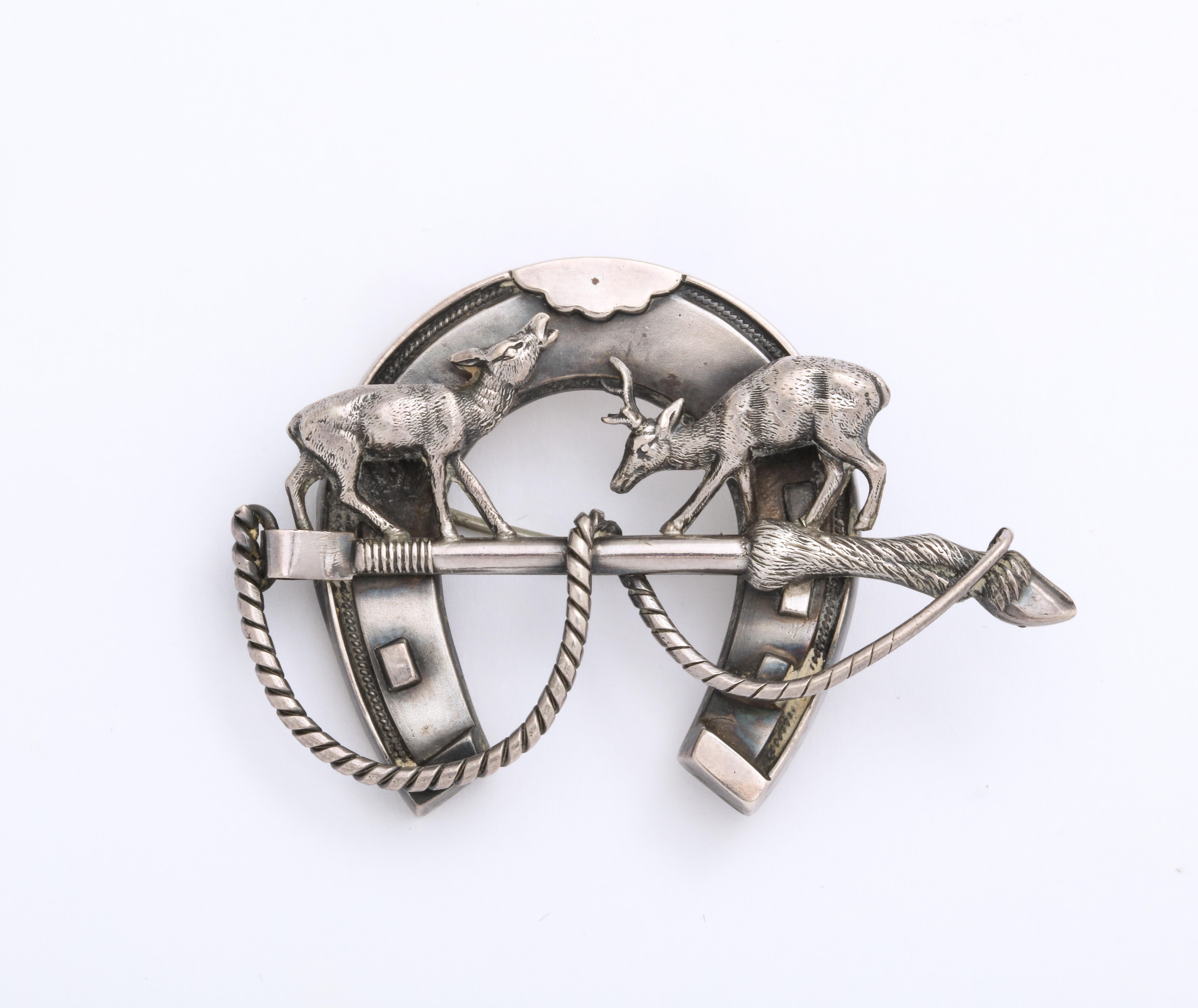 A Scottish Horseshoe brooch in sterling with two sculpted three dimensional deer on top of a deer leg riding crop, is an example of the hunting jewelry in the Victorian era. While the Victorians were nature oriented at this time that did not keep