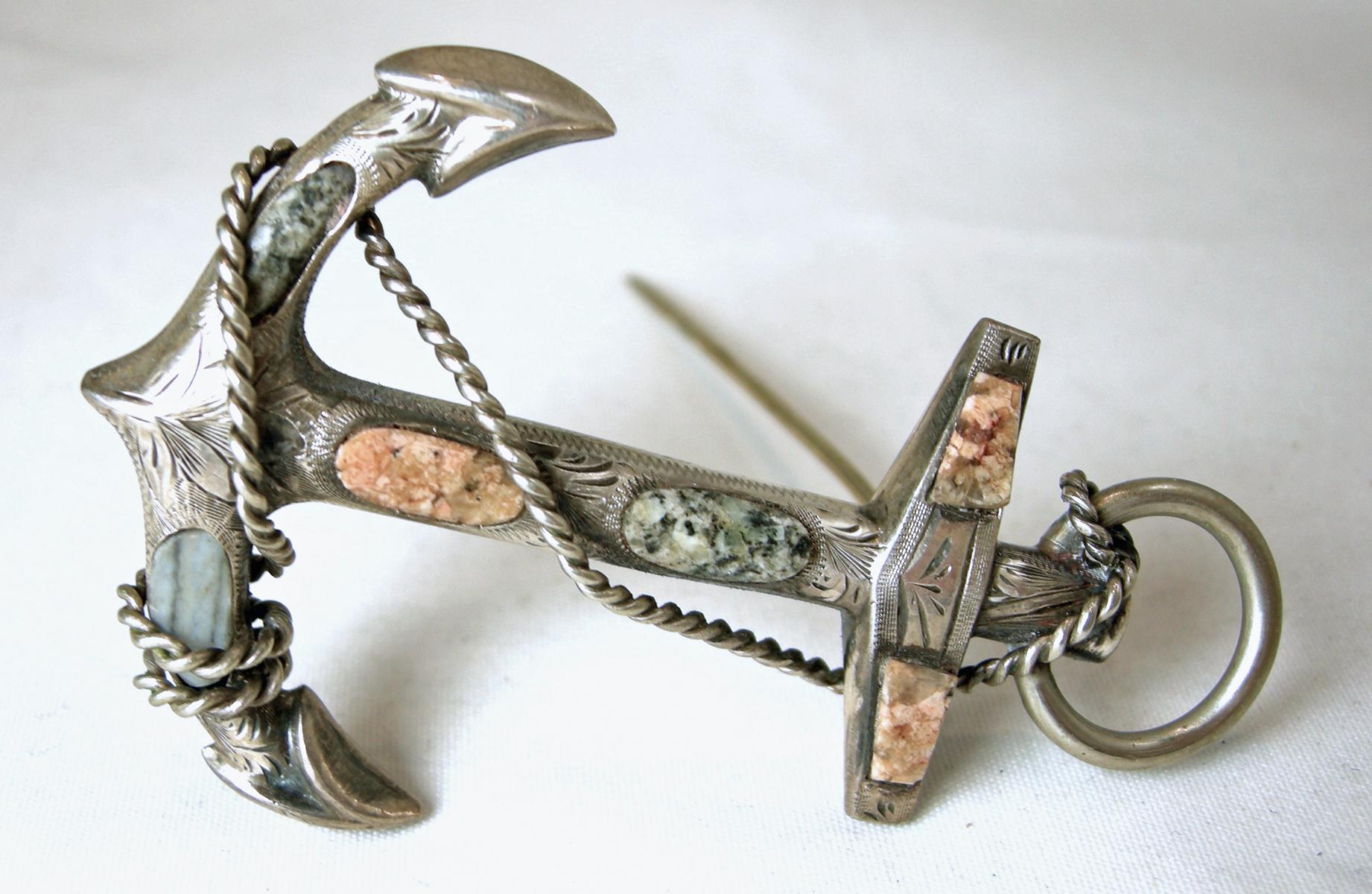 This is a vintage Victorian Scottish brooch from the late 1800s.  It has an anchor with agate stones in a sterling silver setting.  In excellent condition, this brooch measures 2-1/2” x 1-5/8” with a c-pin clasp.