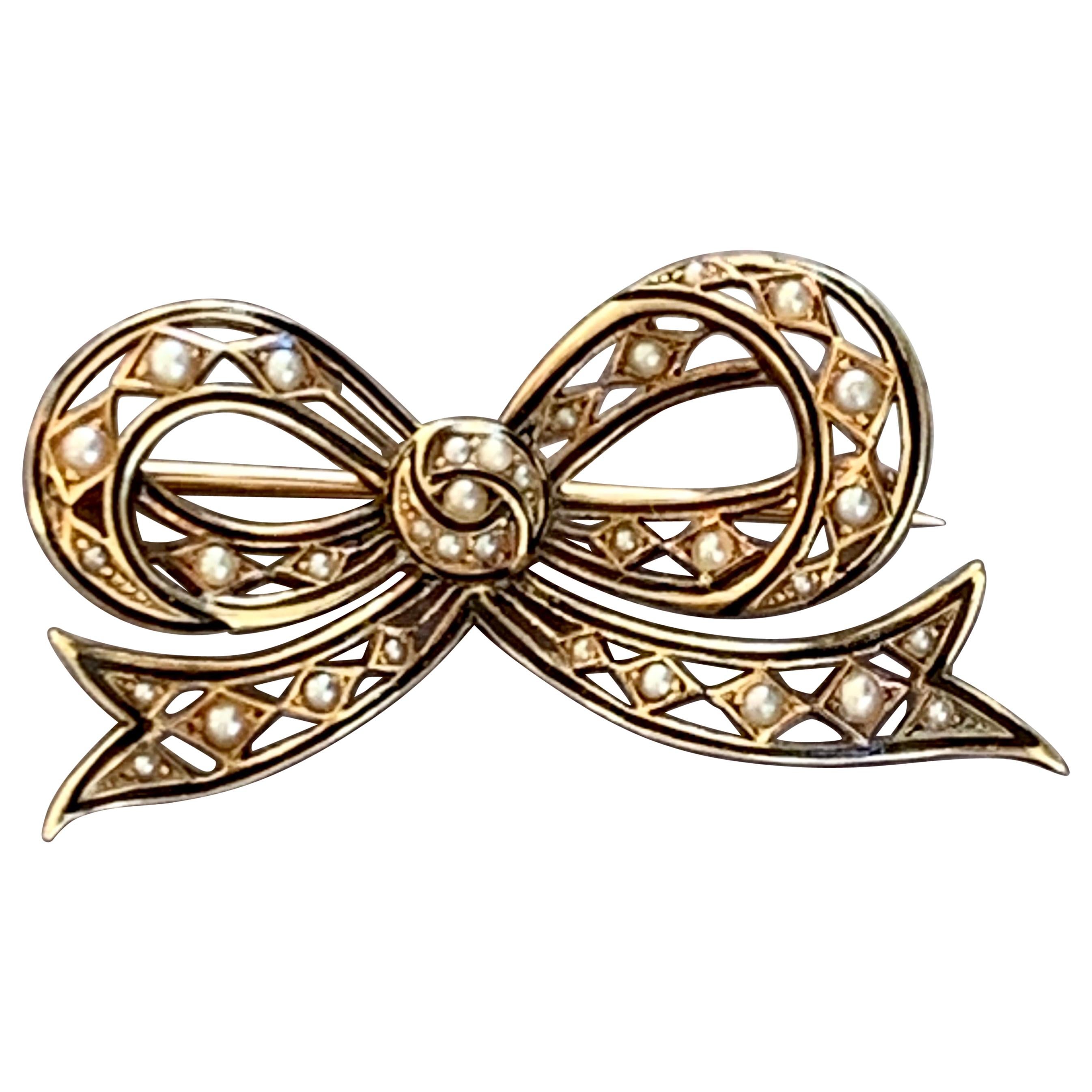 Victorian Seed Pearl and Enamel 14 Karat Yellow Gold Bow Brooch Pin For Sale