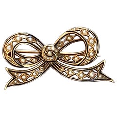 Victorian Seed Pearl and Enamel 14 Karat Yellow Gold Bow Brooch Pin