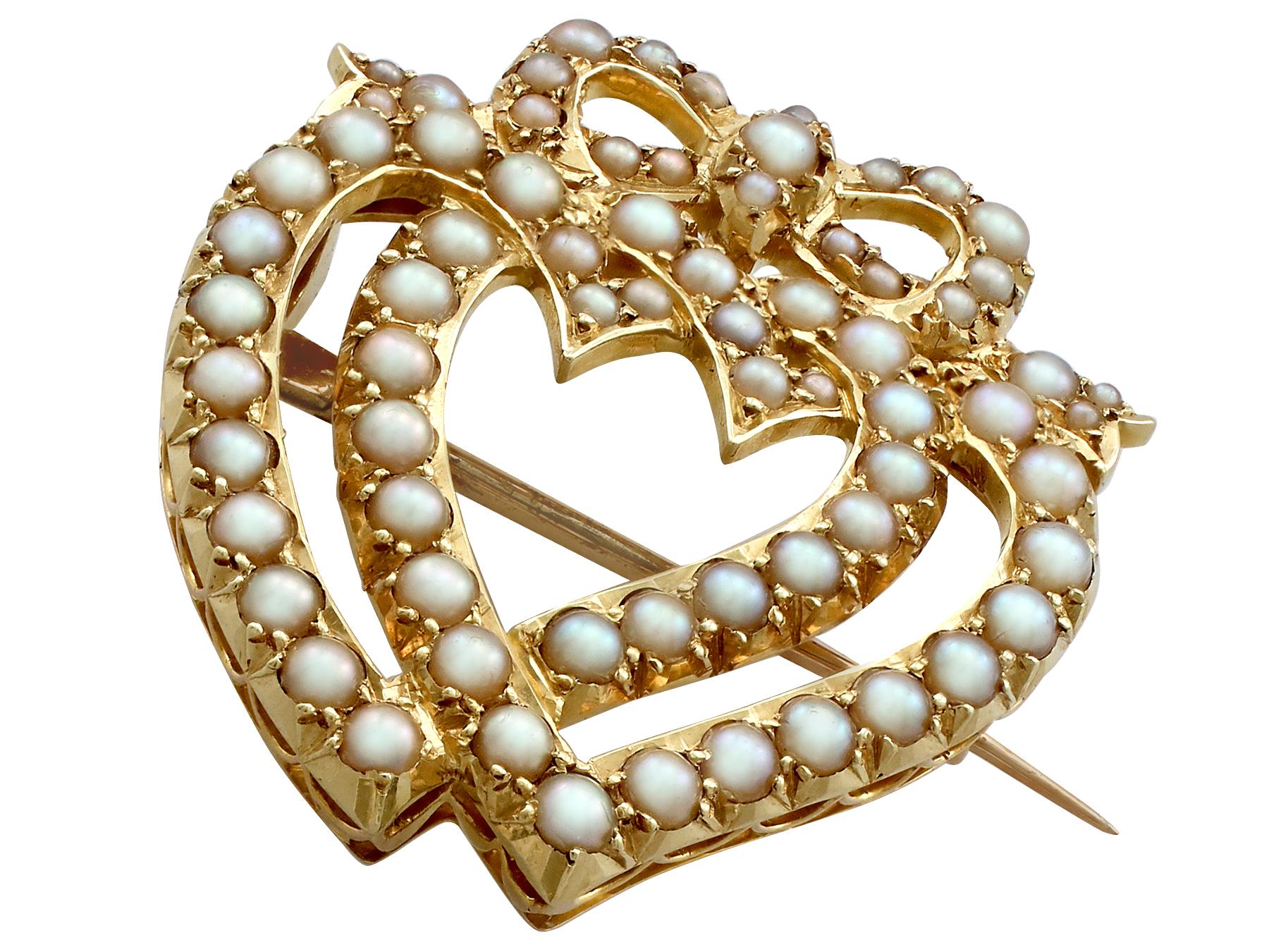 A fine and impressive seed pearl and 18 karat yellow gold heart shaped brooch; part of our diverse antique jewelry and estate jewelry collections.

This impressive large antique heart shaped brooch has been crafted in 18 karat yellow gold.

The