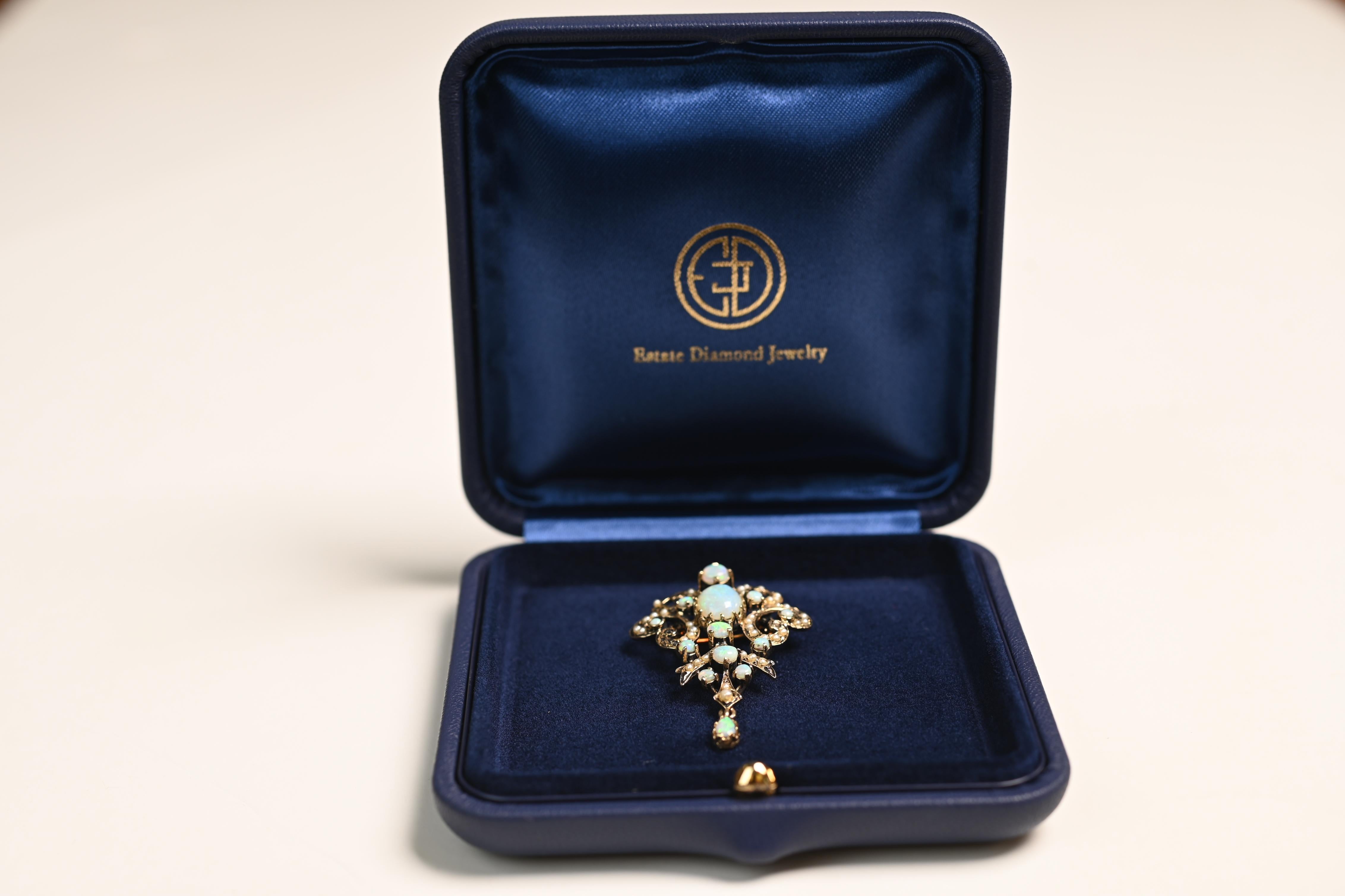This exquisite Victorian-era brooch is a remarkable example of 19th-century craftsmanship, handmade in 14k yellow gold around 1850. The brooch showcases an intricate openwork design, carefully detailed to highlight its ethereal, lace-like