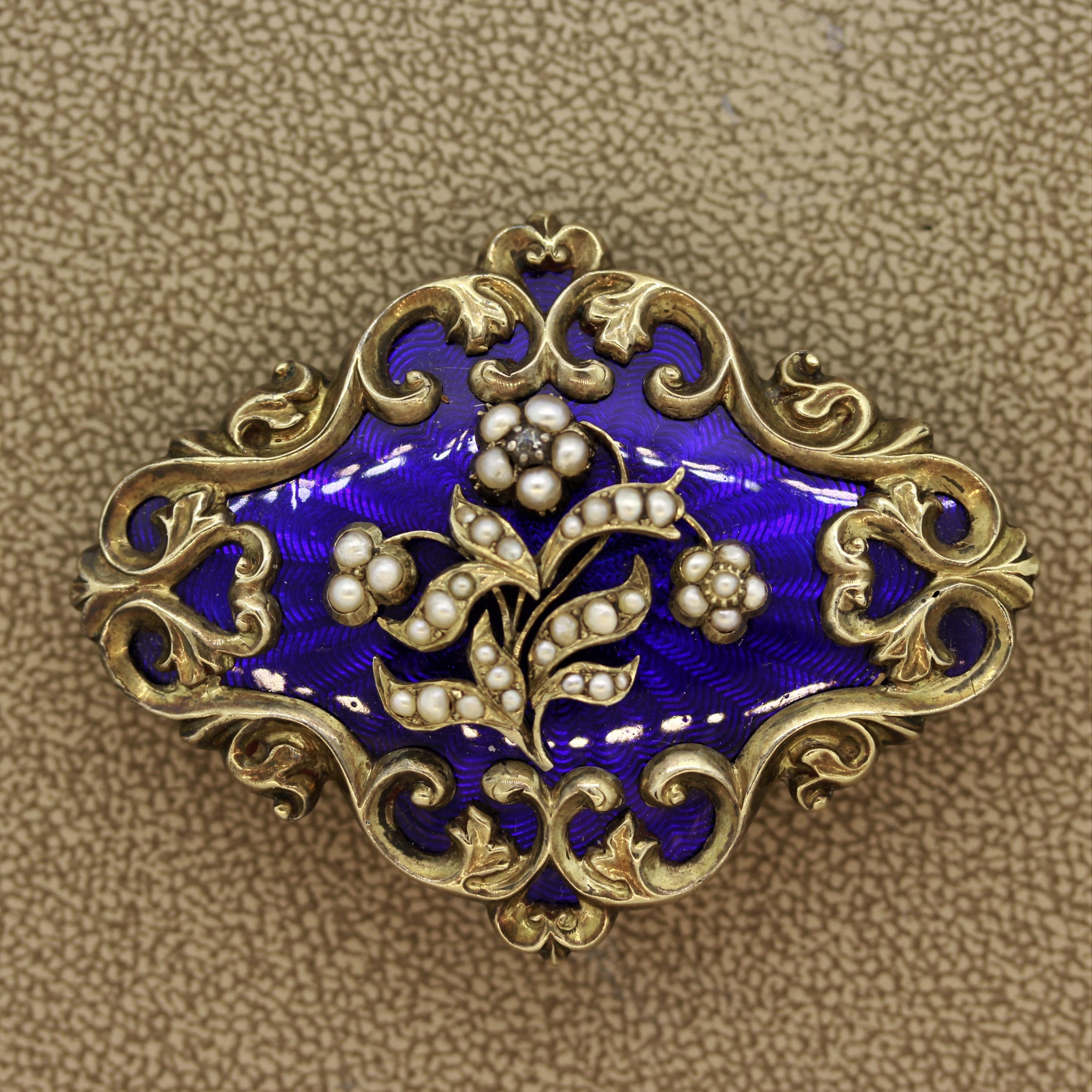A finely made piece full of detail made in the 1880’s. This Victorian original features natural seed pearls set as flowers over hand painted guilloche enamel in a vivid blue color. It also has one small diamond set as the center of a flower. Made in