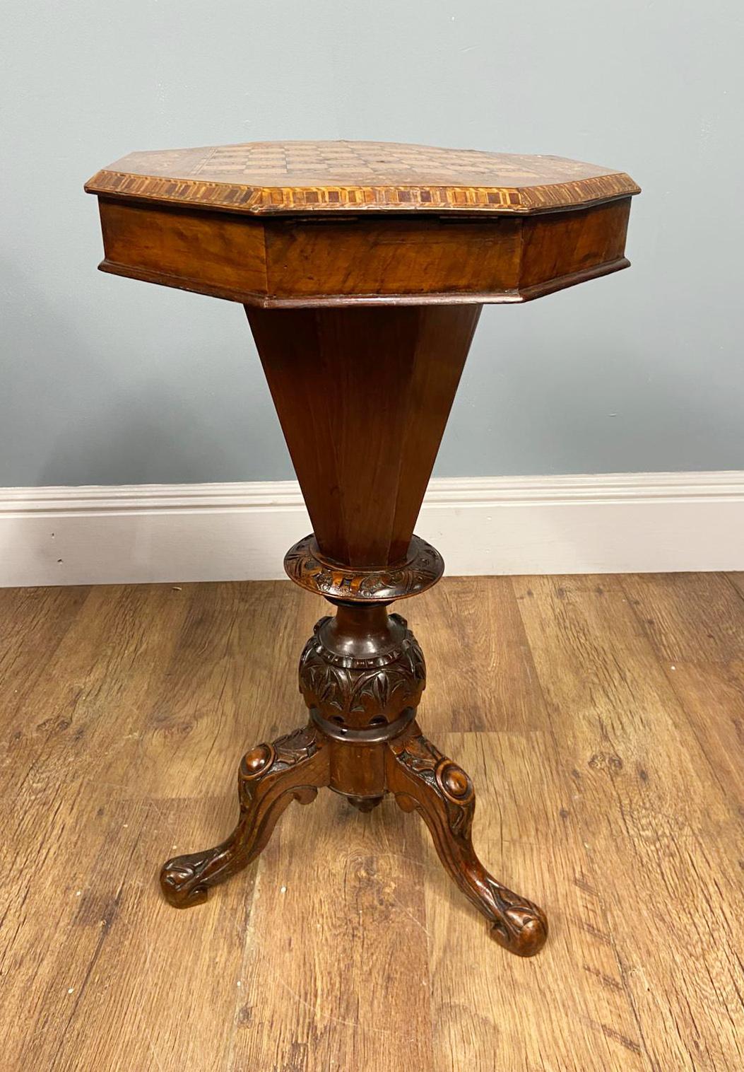 Gorgeous and flexible Victorian games and sewing table
Circa 1880 and with a trumpet form
A charming Victorian sewing and games table, notable for its octagonal form and beautifully inlaid chessboard top
The surface features fine marquetry work with