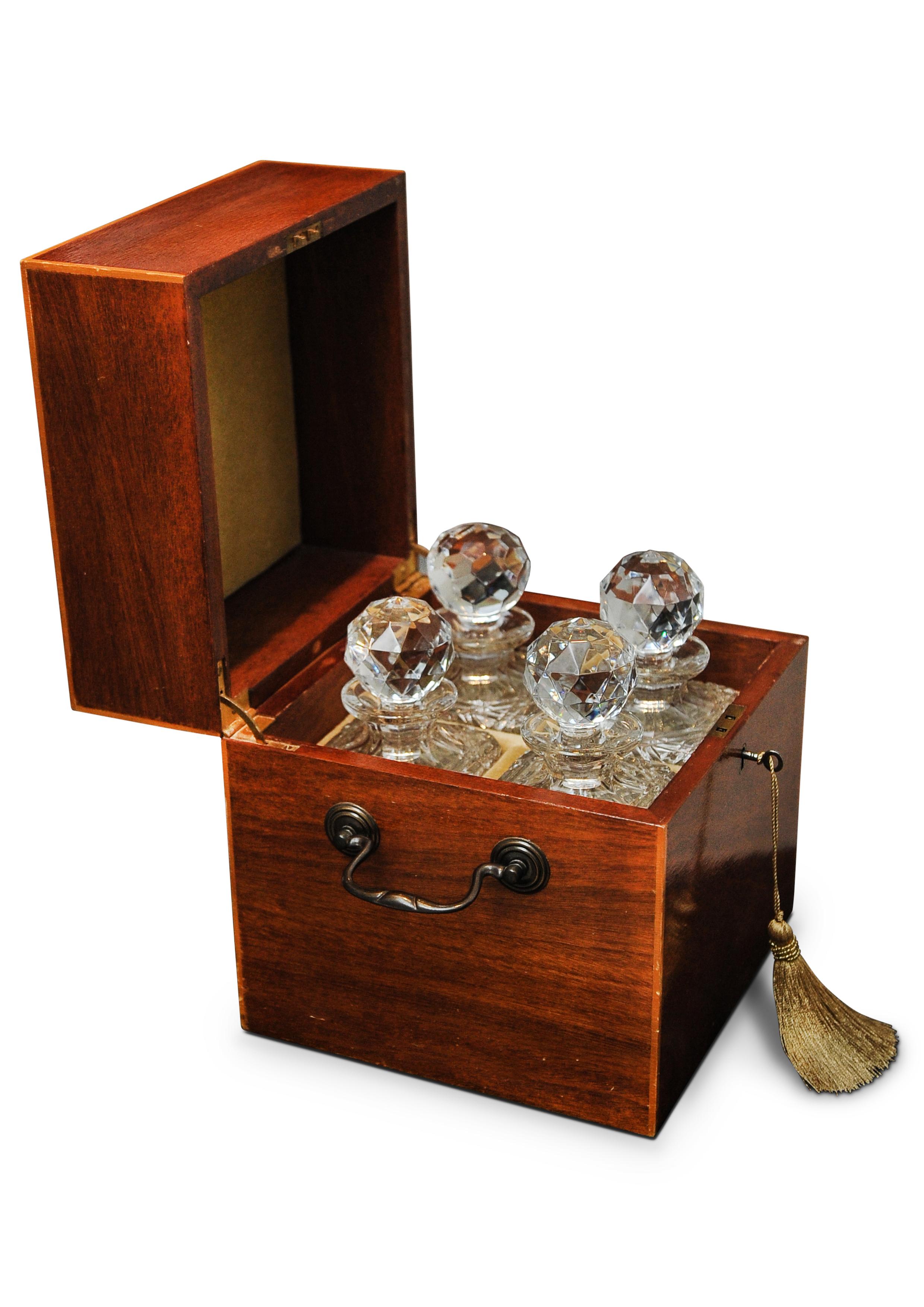 Sheraton Revival Mahogany Decanter Box, With Four Atlantis Decanters & Decorative Inlay

The hinged lid with paterae and line inlaid decoration, the interior with divisions holding with four cut glass decanters with stoppers. 





