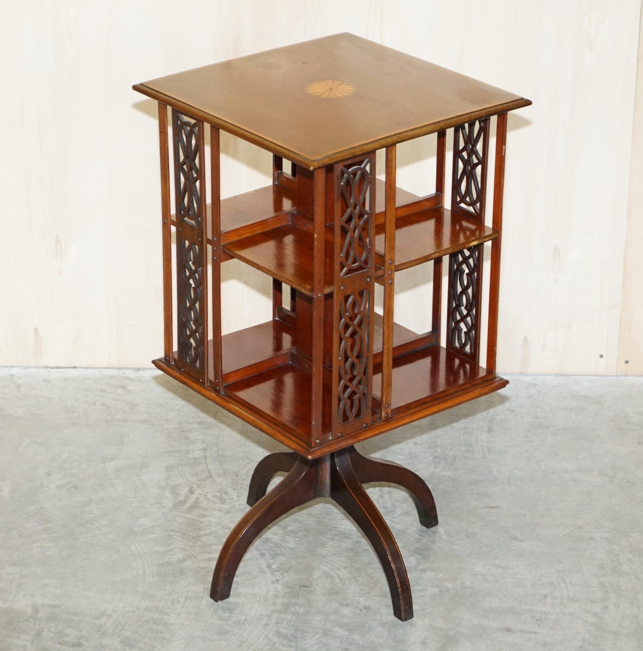 We are delighted to offer for sale this very fine antique Sheraton Revival Mahogany & Satinwood, fret work carved, revolving bookcase table with ornately sculpted legs

A very good looking well made and decorative piece. Made in the Sheraton