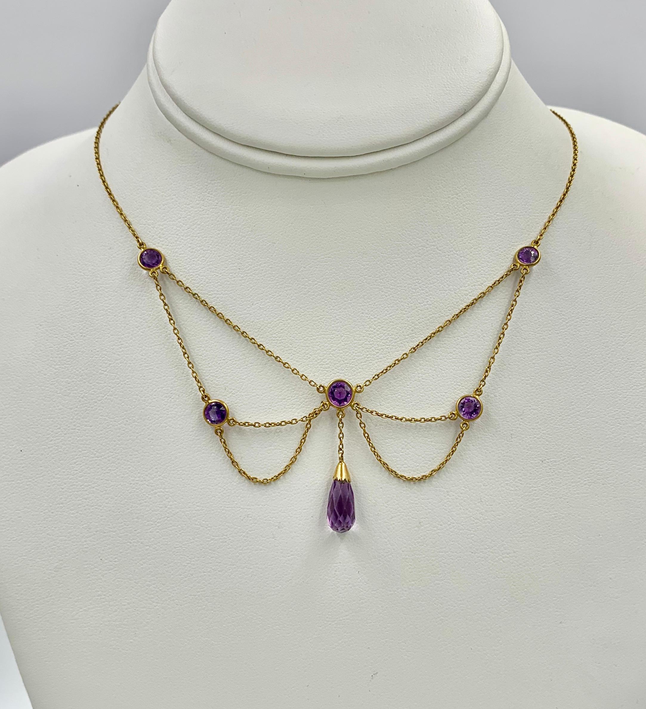 THIS IS A STUNNING VICTORIAN - ART NOUVEAU - BELLE EPOQUE FESTOON NECKLACE WITH THE MOST GORGEOUS NATURAL ROUND AND BRIOLETTE CUT SIBERIAN AMETHYST GEMS SET IN A GORGEOUS OPEN WORK FESTOON SWAG DESIGN IN 14 KARAT ROSE GOLD DATING TO CIRCA