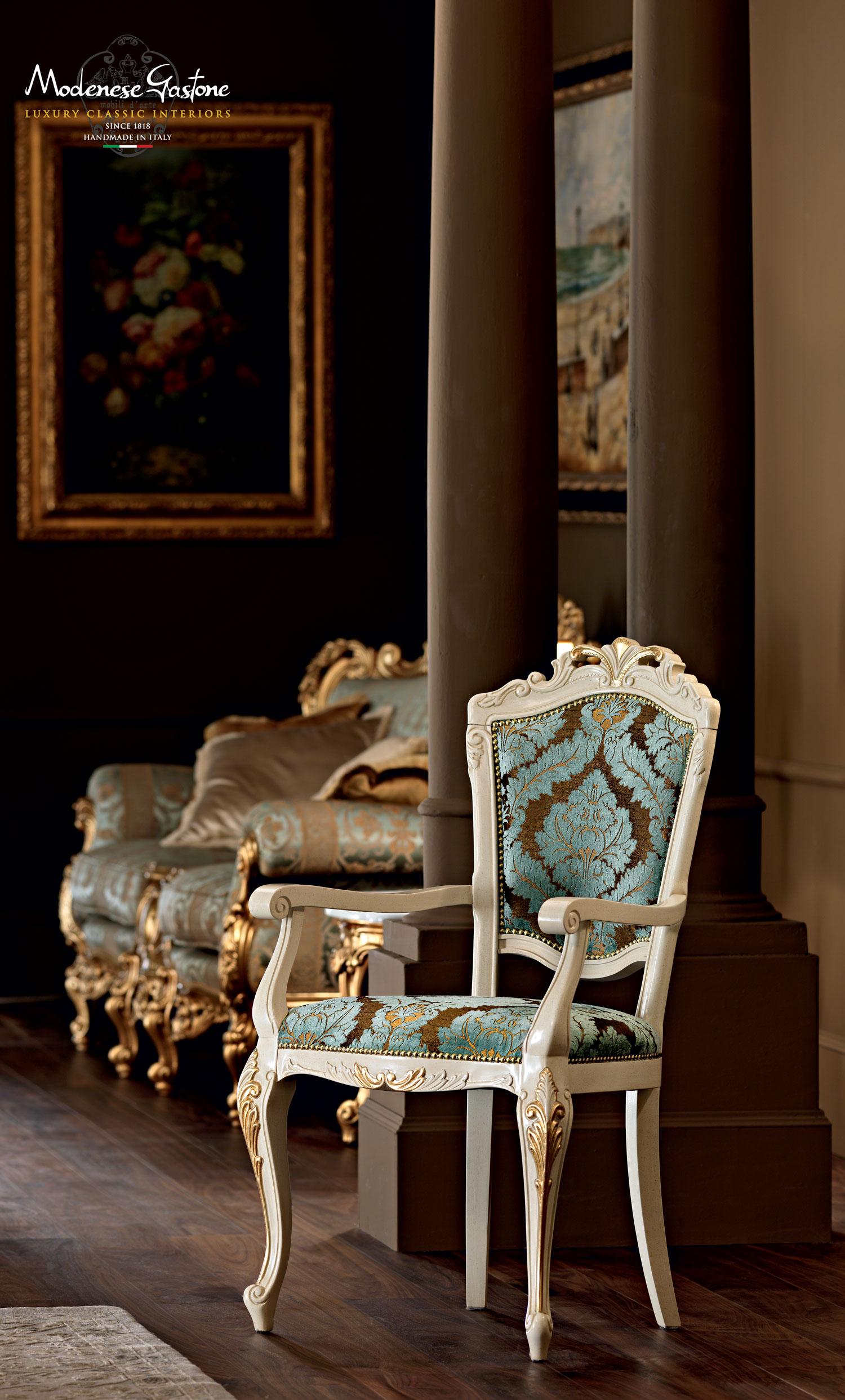 Complete your elegant luxury dining room by pairing your home décor with this victorian high-end side chair by Modenese gastone, featuring a wood frame painted in ivory finishings and hand made gold leaf applications. Seating cushion upholstered in