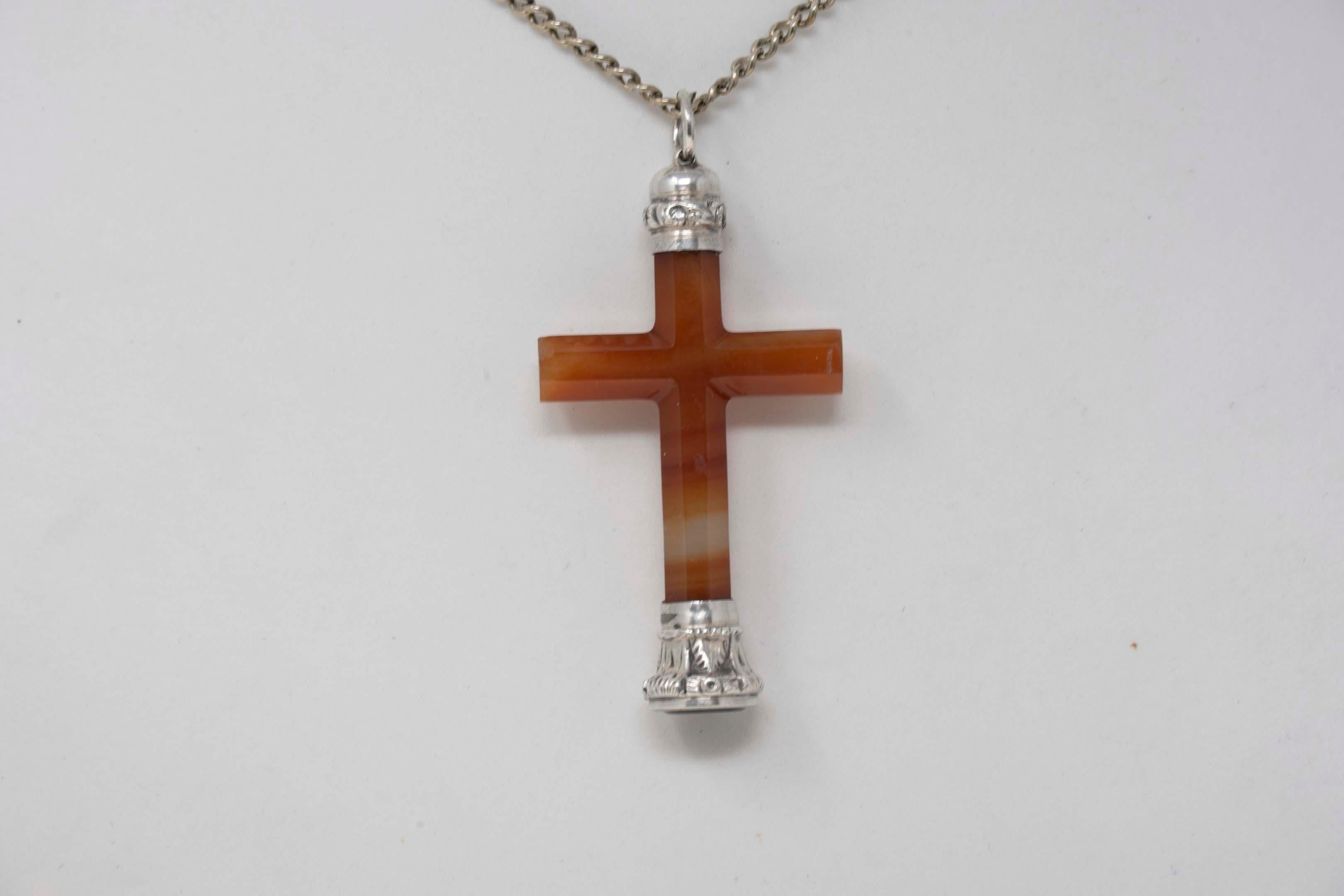 Victorian silver agate cross and chain with flower intaglio. Chain measures 27 inches long, cross measures 2 inches long x 1 1.4 inches wide. In good condition, no maker mark, circa 19th century.
