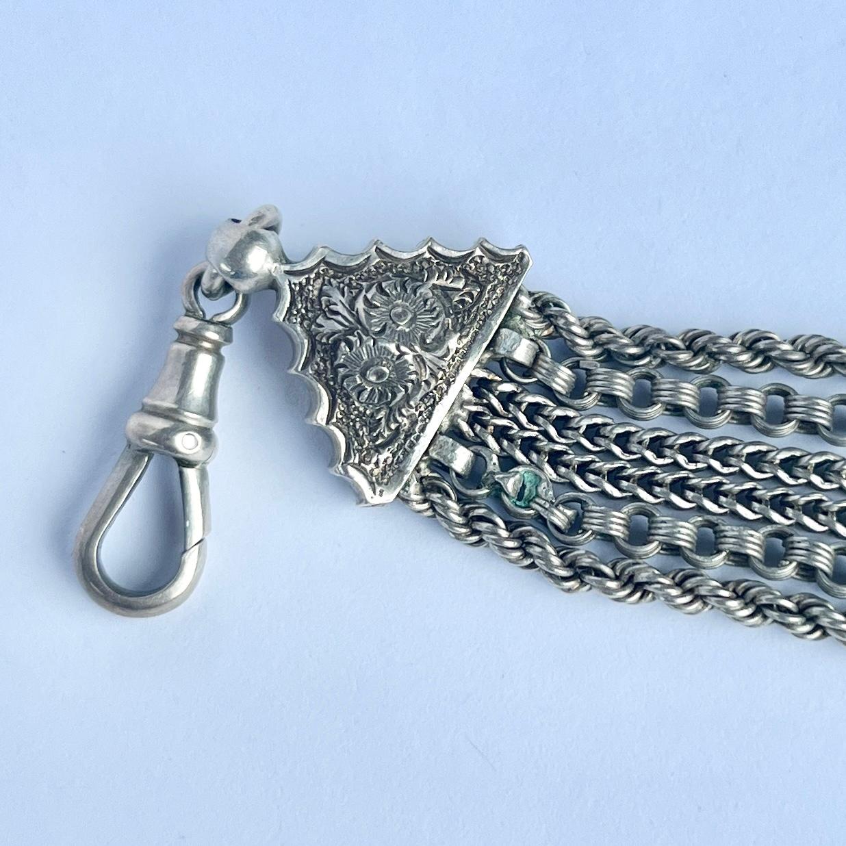 An Albert chain is an essential in any gents wardrobe. This particular Albert  is made up of different style chains. There is a dog clip at one end and a bolt ring clasp.  

Length: 24.5cm

Weight: 34.5g