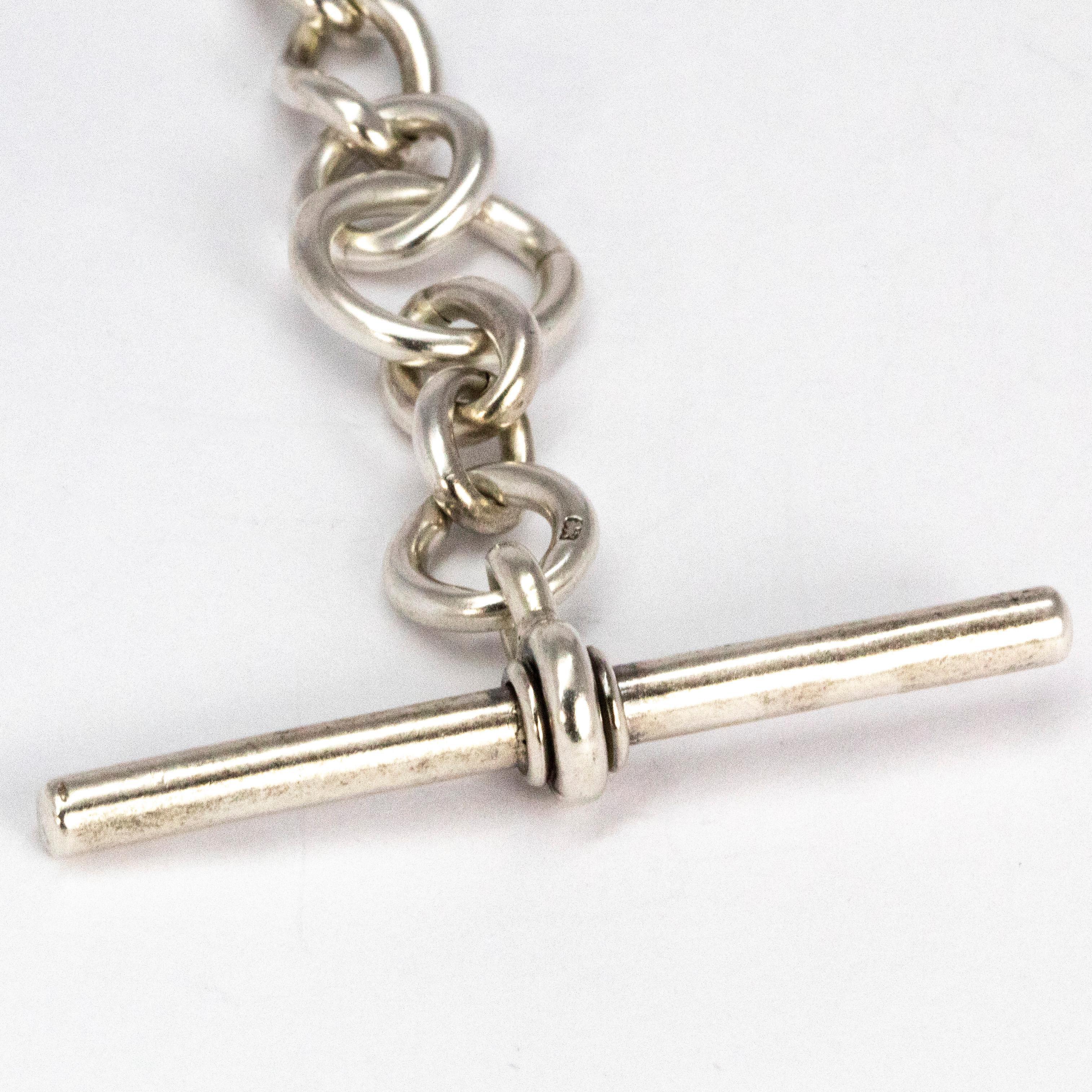 This albert chain could be used as a classic albert or could be worn as a necklace with a drop t-bar. The chain fastens using two dog clips. Modelled in silver. 

Length: 17inches 
T-bar Drop: 3inches 