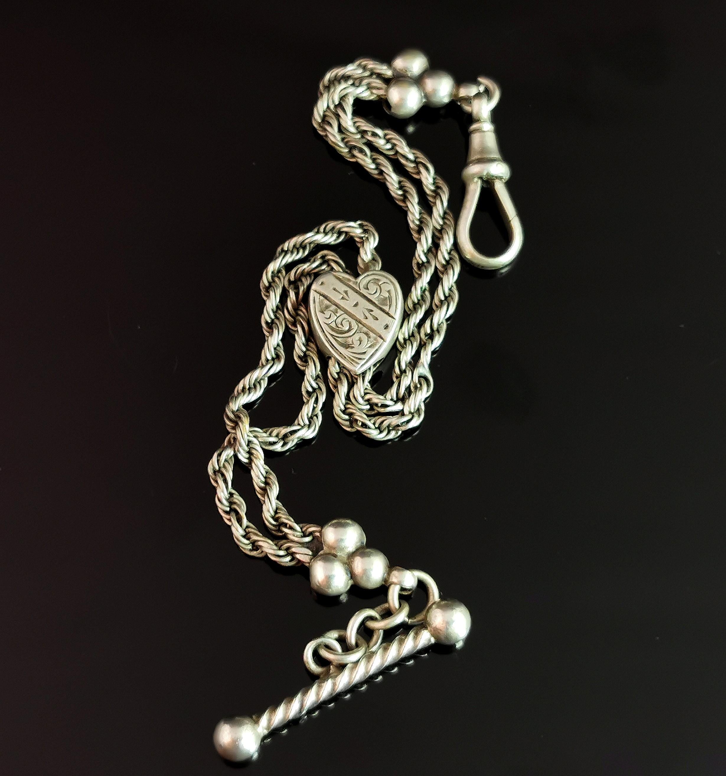 A beautiful antique Victorian era, sterling silver albertina chain.

It is a double rope chain with a twist detail t bar to one end a dog clip fastener to the other, these are shouldered by a sterling silver trefoil bead.

The chain has a pretty