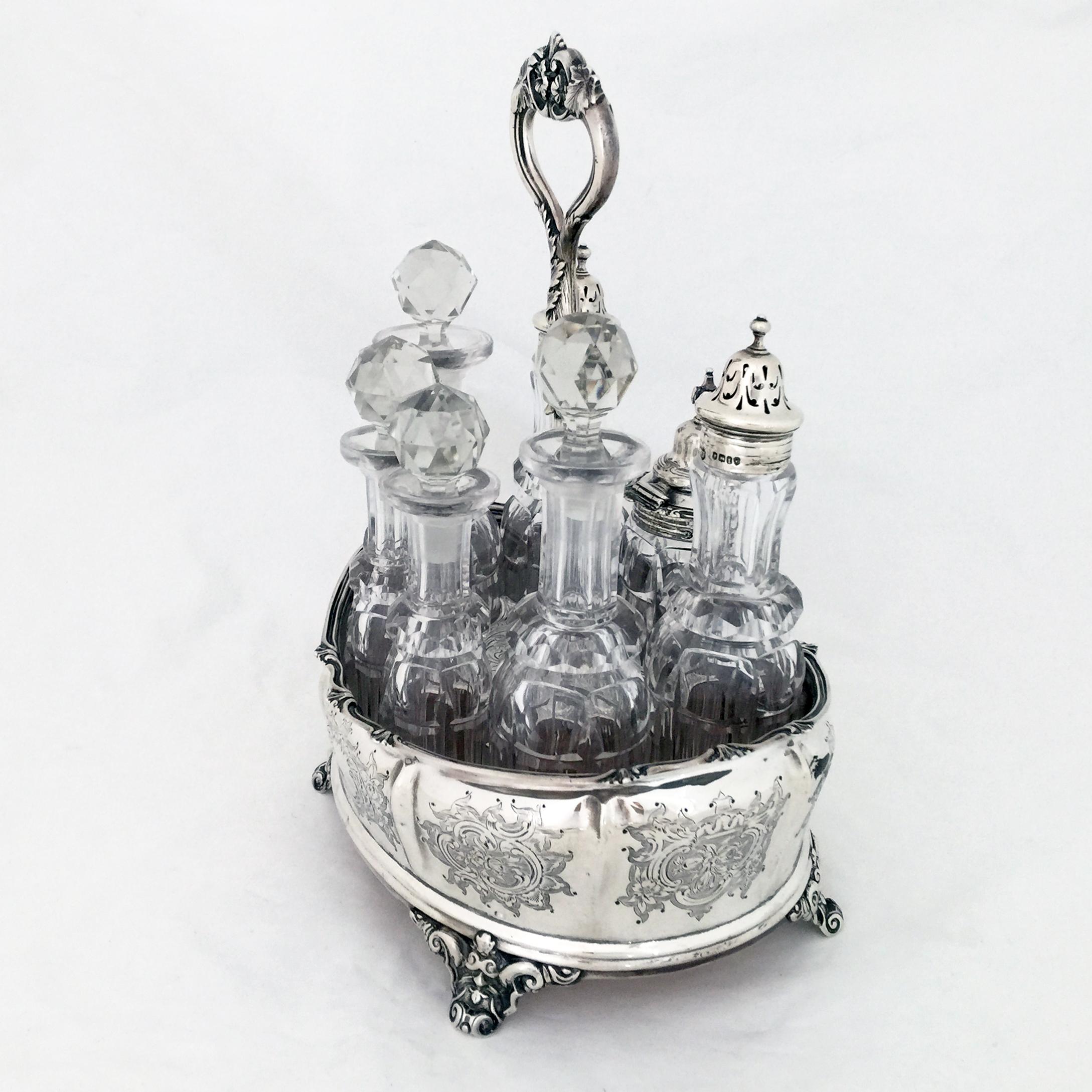 A Victorian English silver cruet with all original seven crystal bottles in fine order

Cruets like this date from an era when food was served fairly bland and each diner would add his or her spice -chili  oils, nutmeg , salt and pepper and
