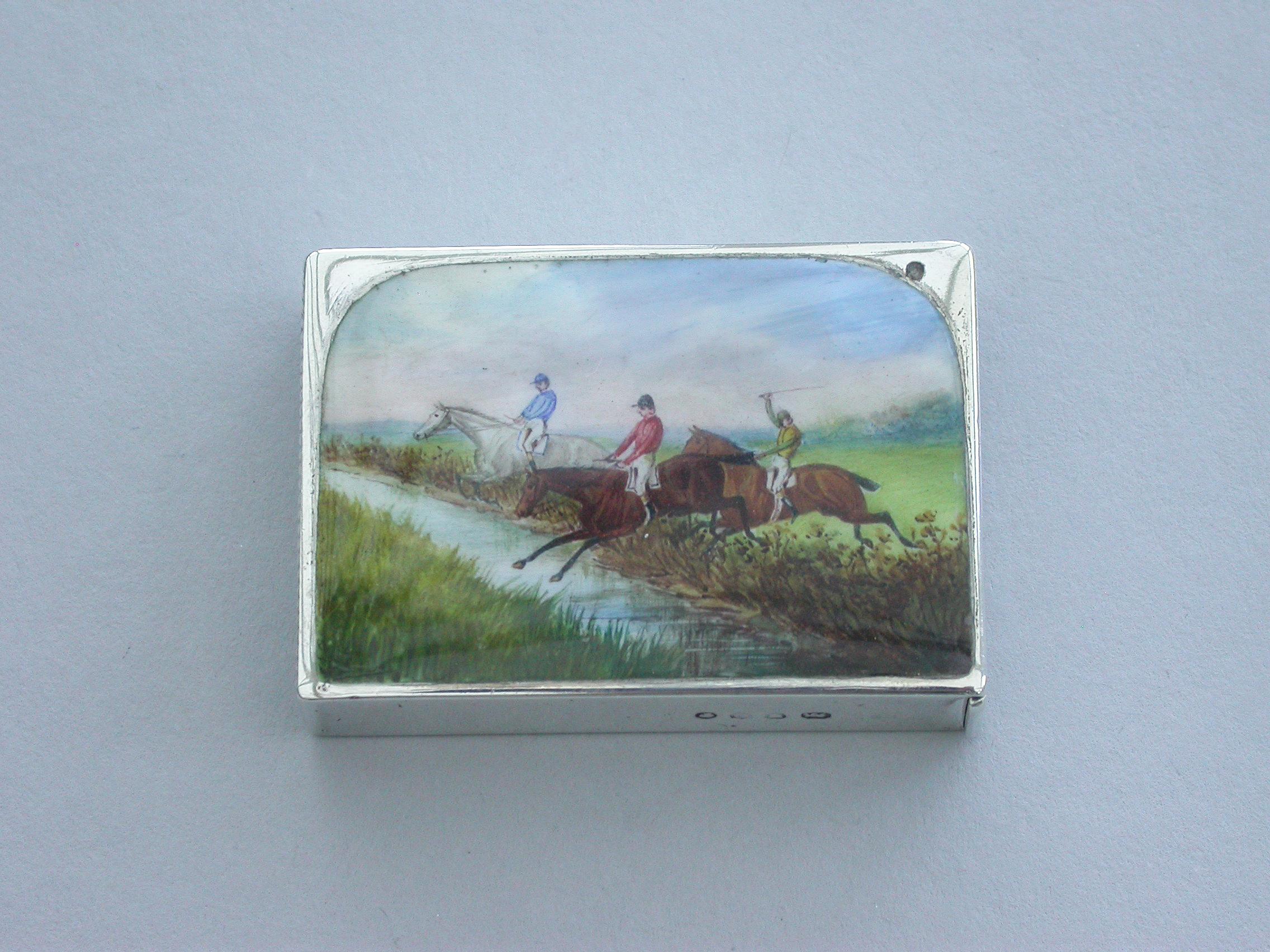 A fine and rare Victorian silver and enamel Vesta Case of rectangular flat-top form, the face enamelled with a 