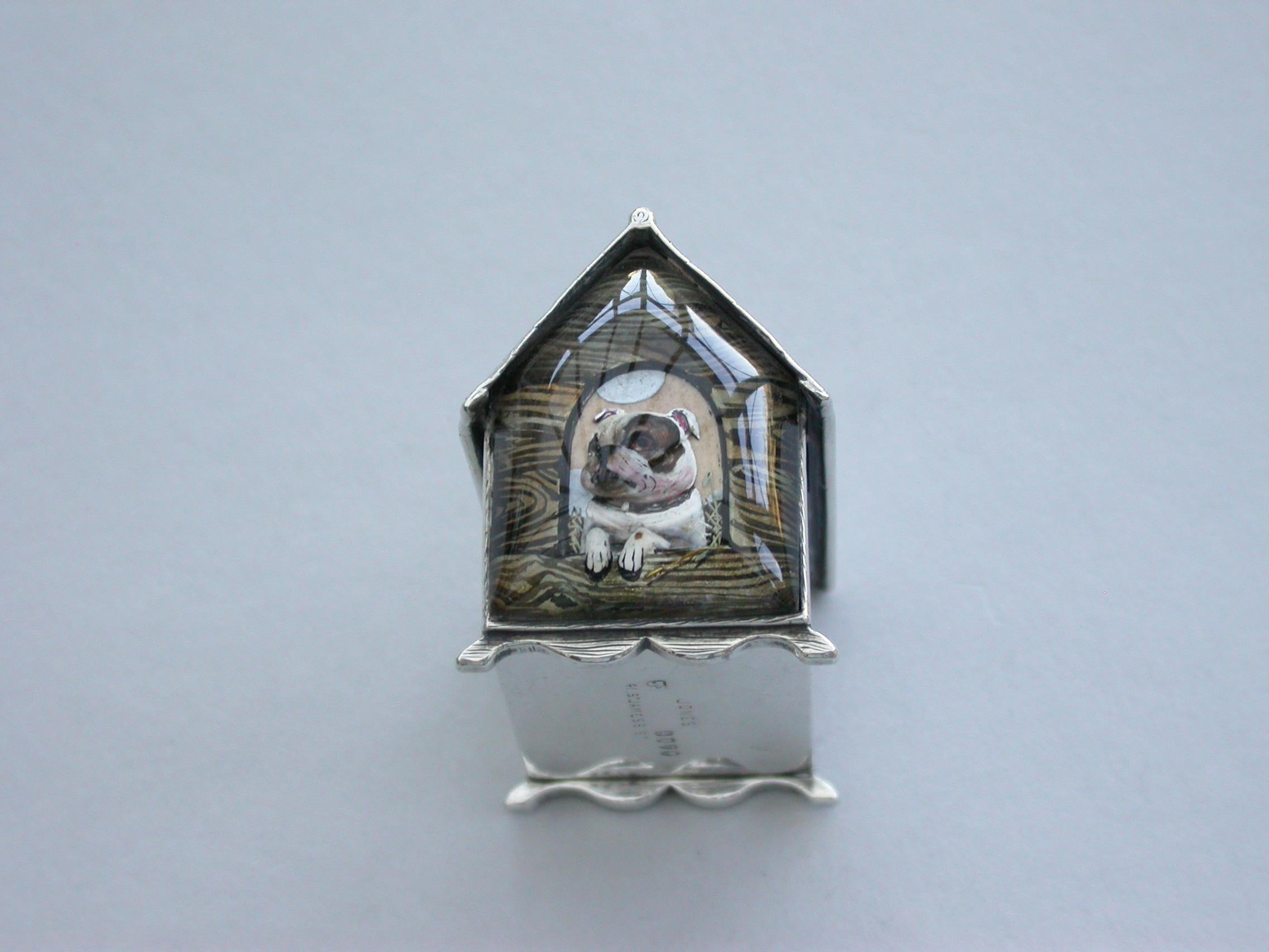 A very fine Victorian novelty silver and Essex rock crystal vesta case, modelled as a slatted wooden dog kennel, the front with an applied Essex rock crystal panel depicting a bull dog, the back pull-out drawer with silver gilt interior and striking