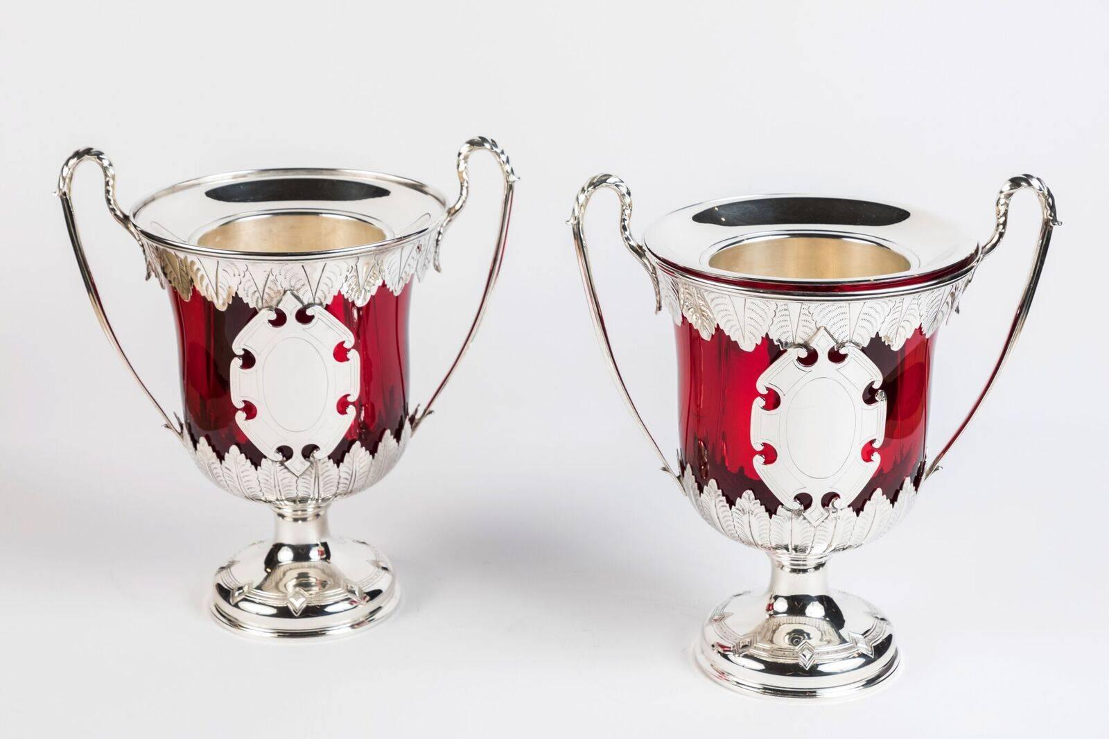 Fabulous pair of 19th century, etched silver ice buckets with foliate motif rim and base, and elegant, serpentine handles. Each inset with original, ruby glass.