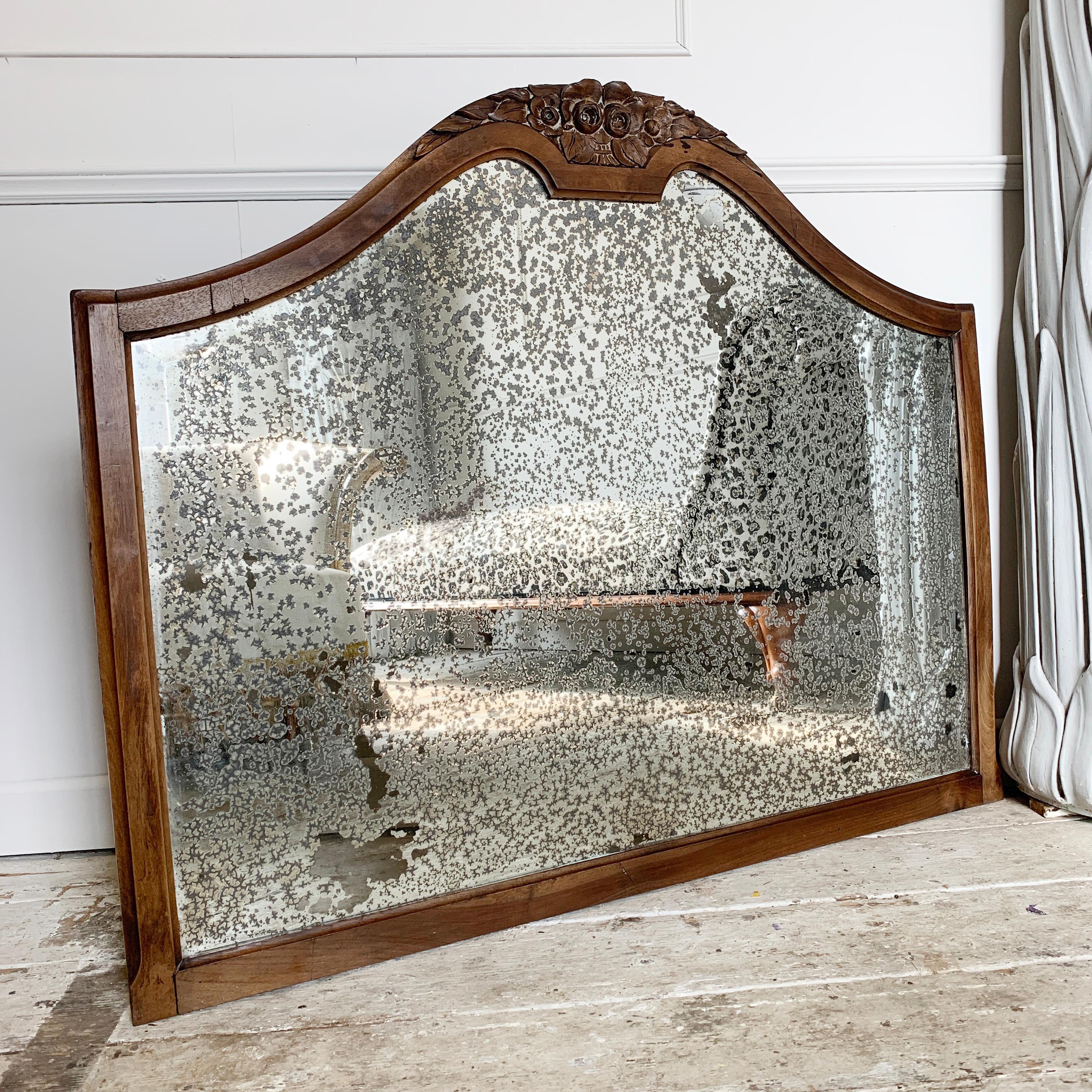 Large Victorian overmantle mirror, with carved fauna decorative crest

The silver backed plate is one of the most fabulously foxed examples we have encountered, giving this mirror a character that makes it a dream interiors piece

One side of the