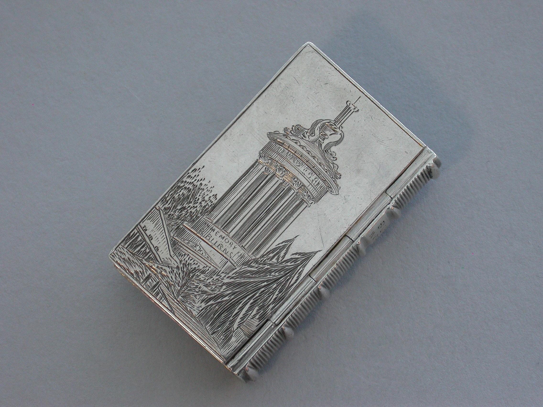 A good Victorian silver castle-top Vinaigrette made in the form of a book, the 'covers' engraved to the front with scrolling leaves against a mottled ground surrounding a cartouche engraved 'Isabella' and to the back with the Burns Monument