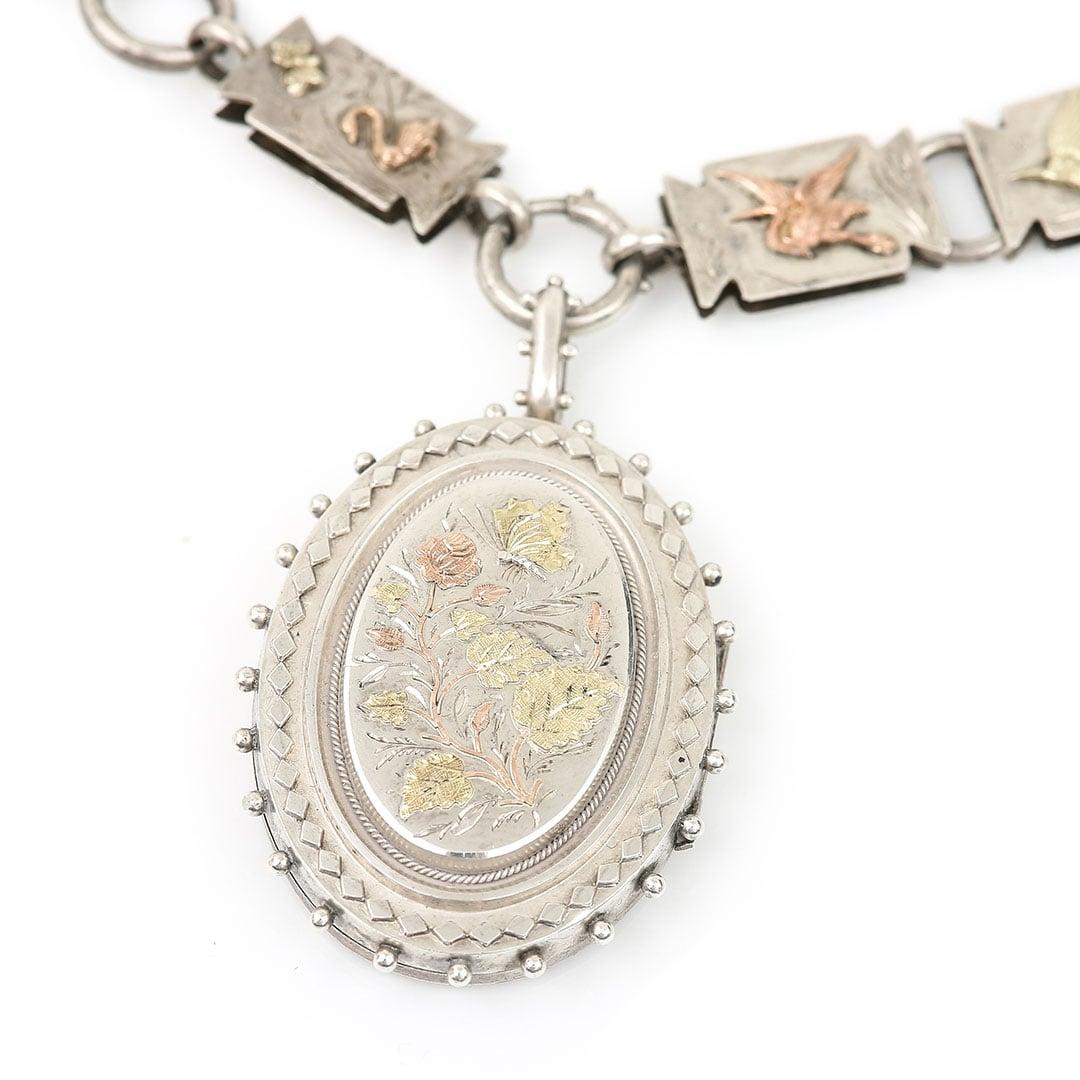 This fabulous and one-of-a-kind Victorian antique book link chain is beautifully adorned with rose and yellow gold meadow birds, animals and insects. Dating from circa 1880 each of 19 panels of the chain is decorated with a miniature meadow scene