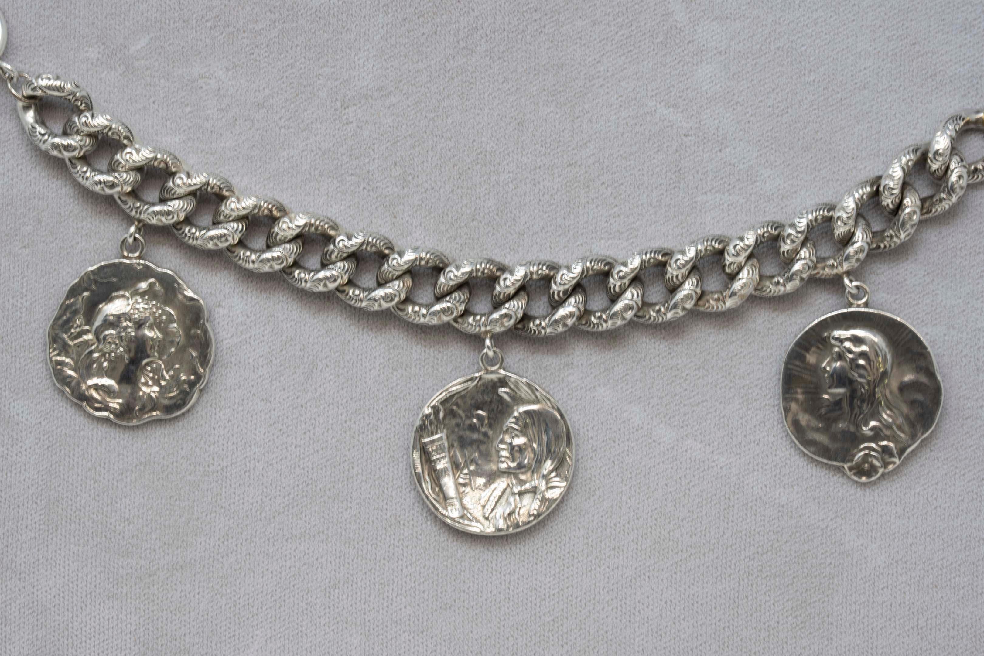 Sterling silver link bracelet with medal charms showing two Victorian ladies and a native American. Stamped on the back with the hallmark of Unger Bros Actif from 1874-1914, Newark NJ. Bracelet measures 8 inches long x 1/2 inches wide. Each medal