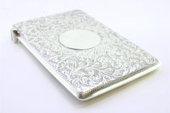 Victorian silver card case with plant motifs and monogram