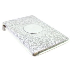 Victorian silver card case with plant motifs and monogram