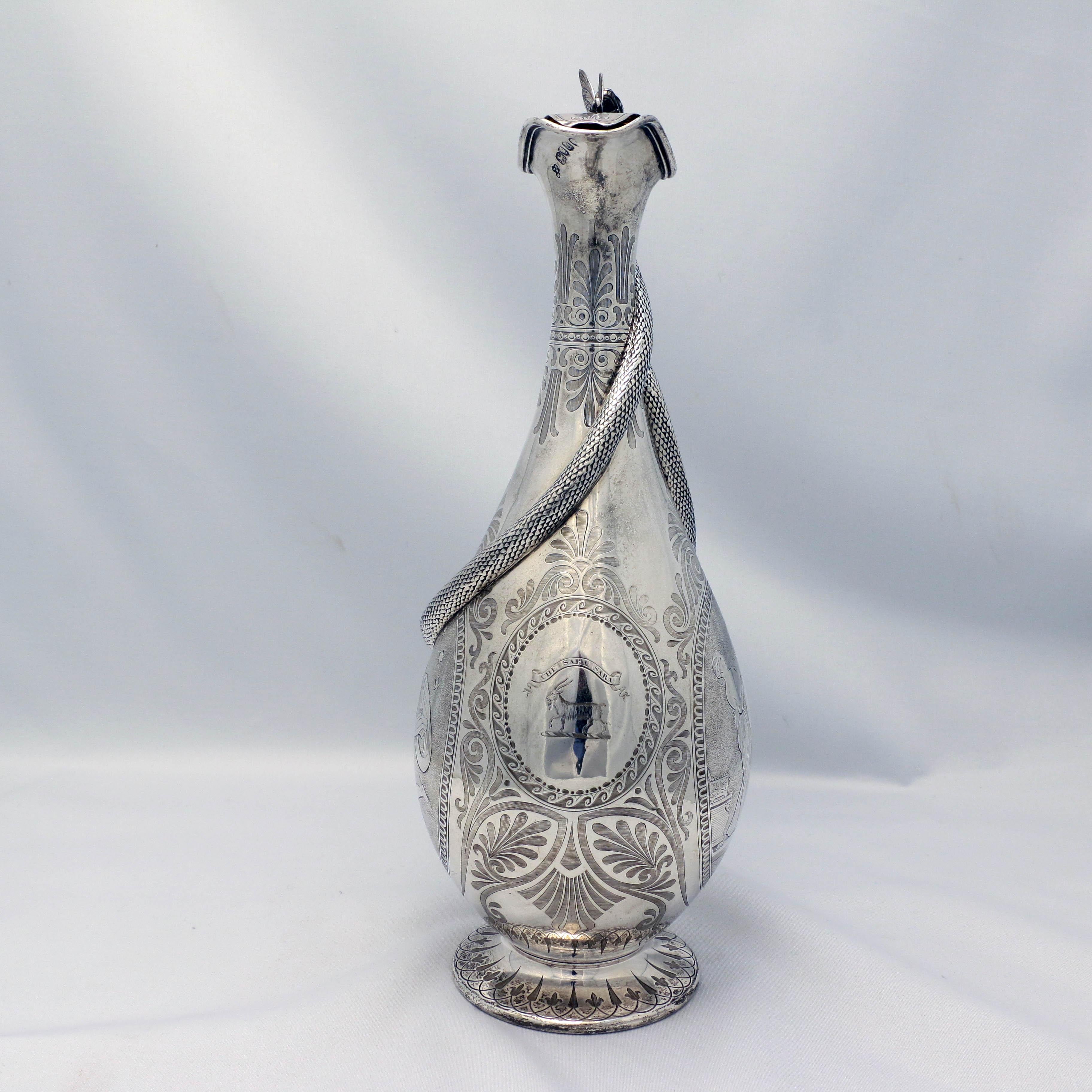 Made in 1854 by the Barnard Brothers, based on a classical style, this jug is about as interesting as such a piece could possibly be. The pear-shaped ovoid body is centered by a circular panel crested with a goat and the motto 