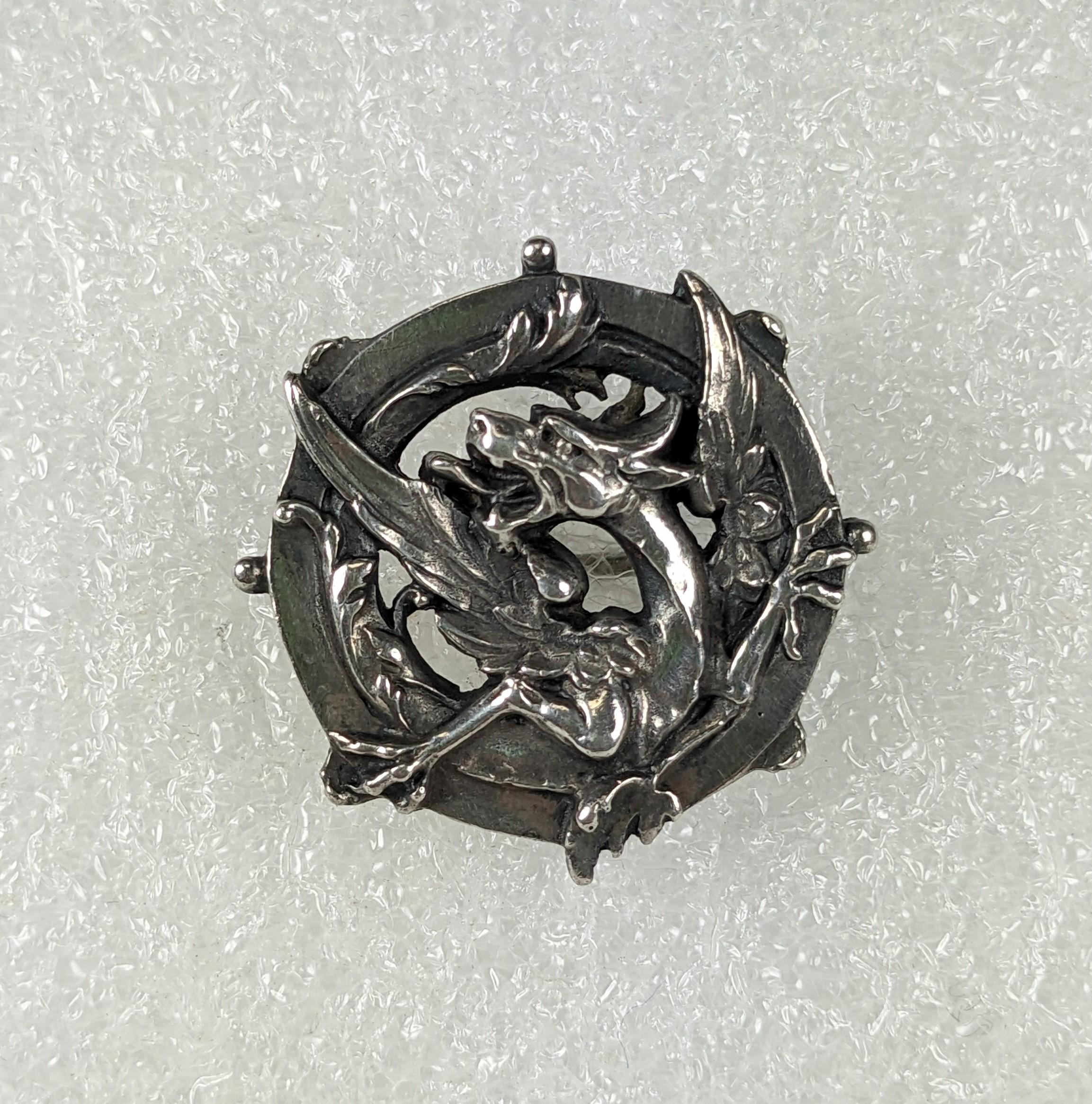 silver brooch dragon age