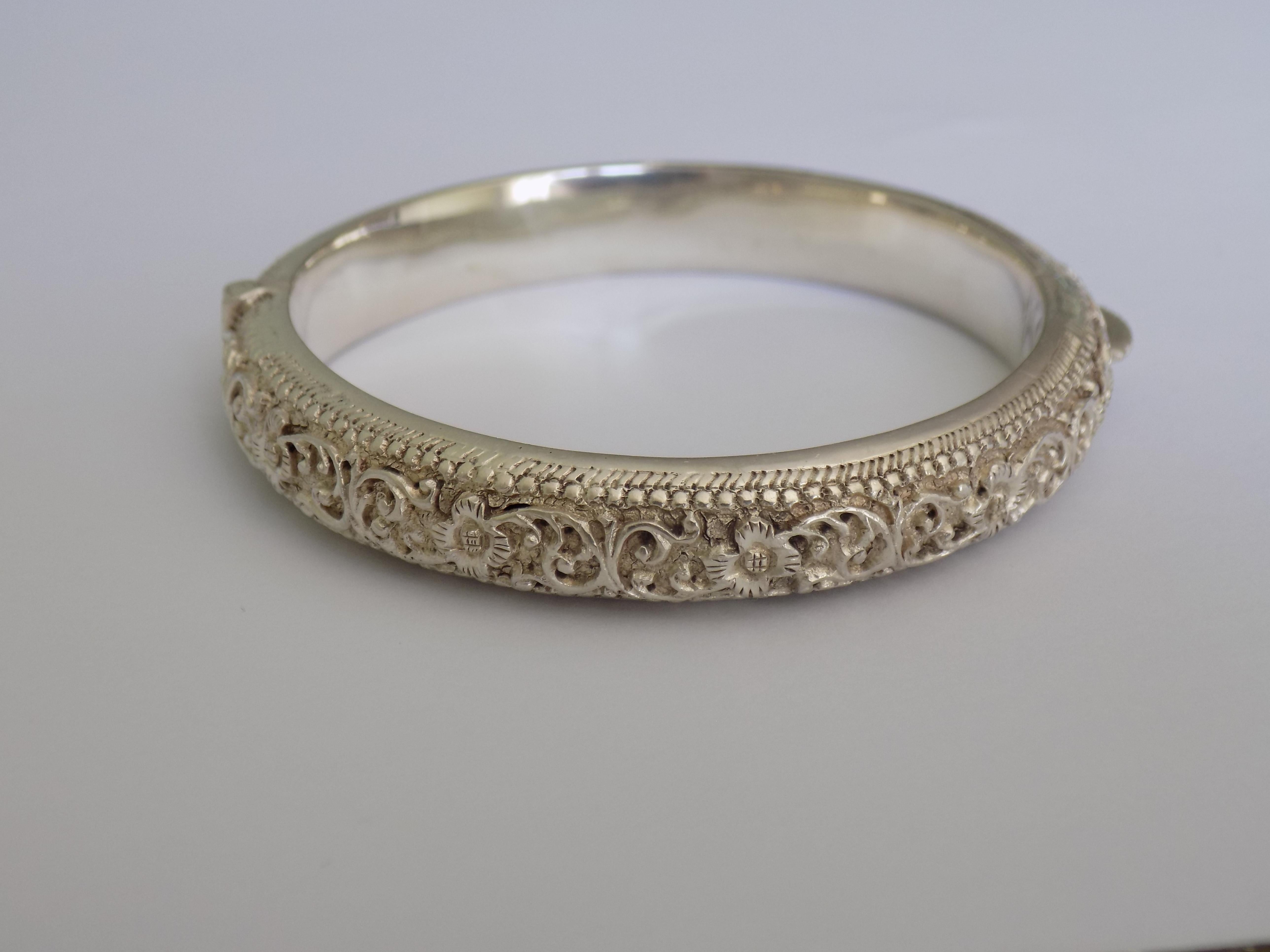 A Lovely Antique Victorian solid Silver Floral repousse bangle for child. The bangle with engraved initials M.A.D. The bangle well made.
Width 9mm.
Diameter inside of the bangle 49mm,
Unmarked, tested positive for Silver.
The bangle in good
