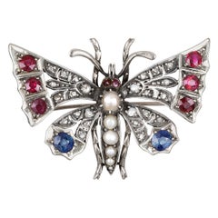 Broche papillon victorienne en argent doré avec diamants, saphirs, rubis et perles