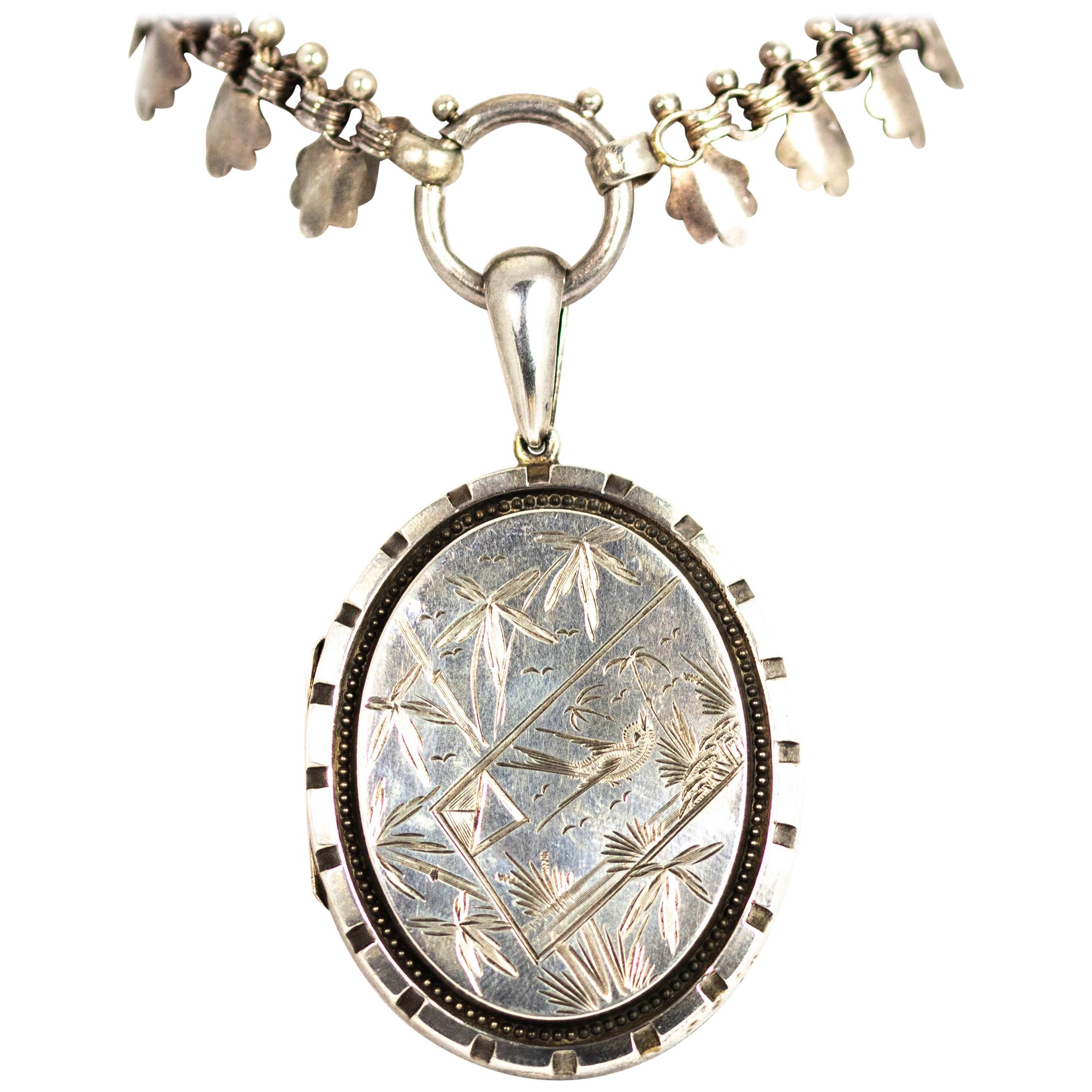 Victorian Silver Locket with Bird and Floral Detail