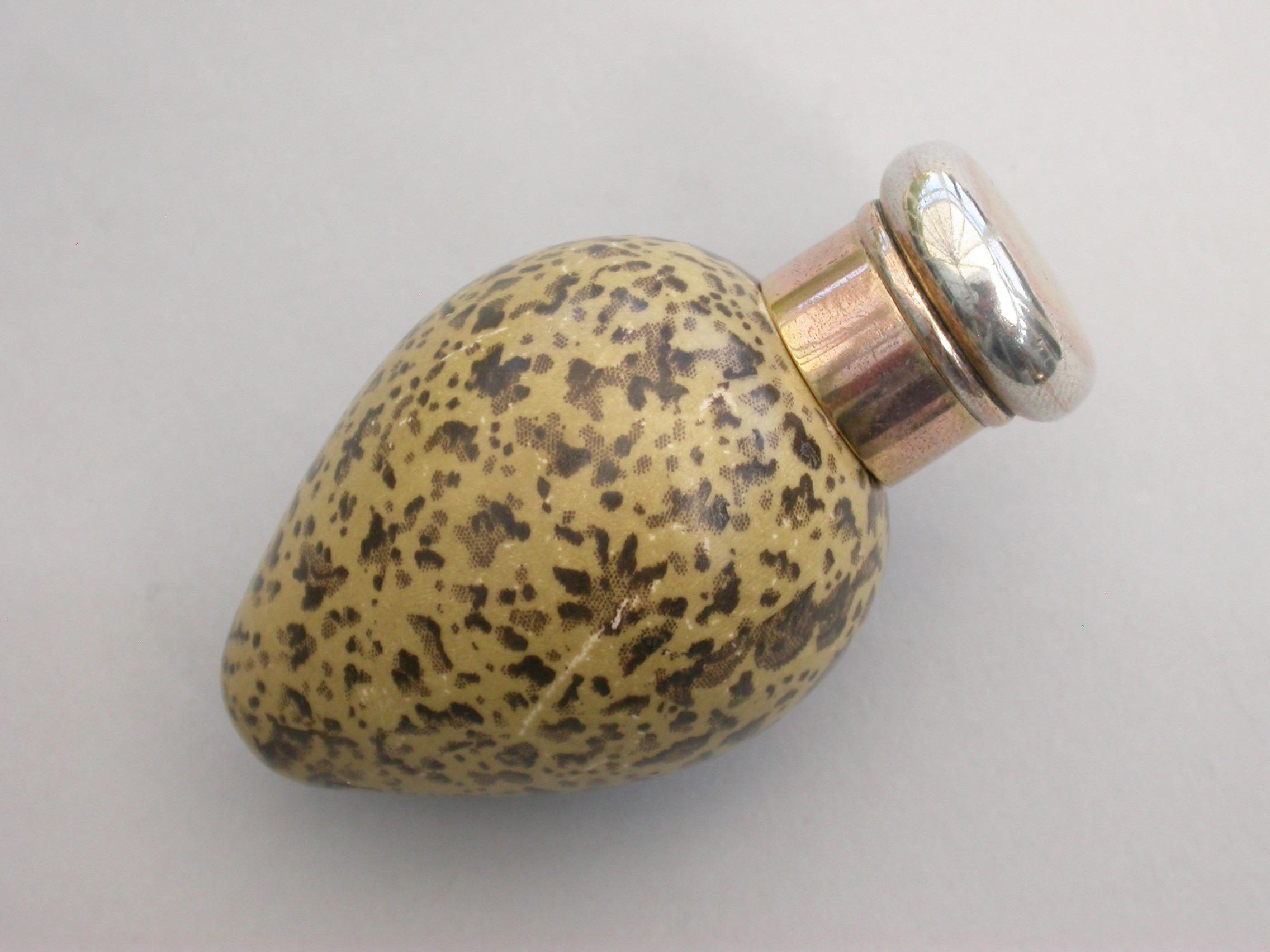 A good Victorian novelty silver and MacIntyre ceramic scent bottle made in the form of a black headed gulls egg with silver gilt screw-off top.

By Sampson Mordan & Co, London, 1884.