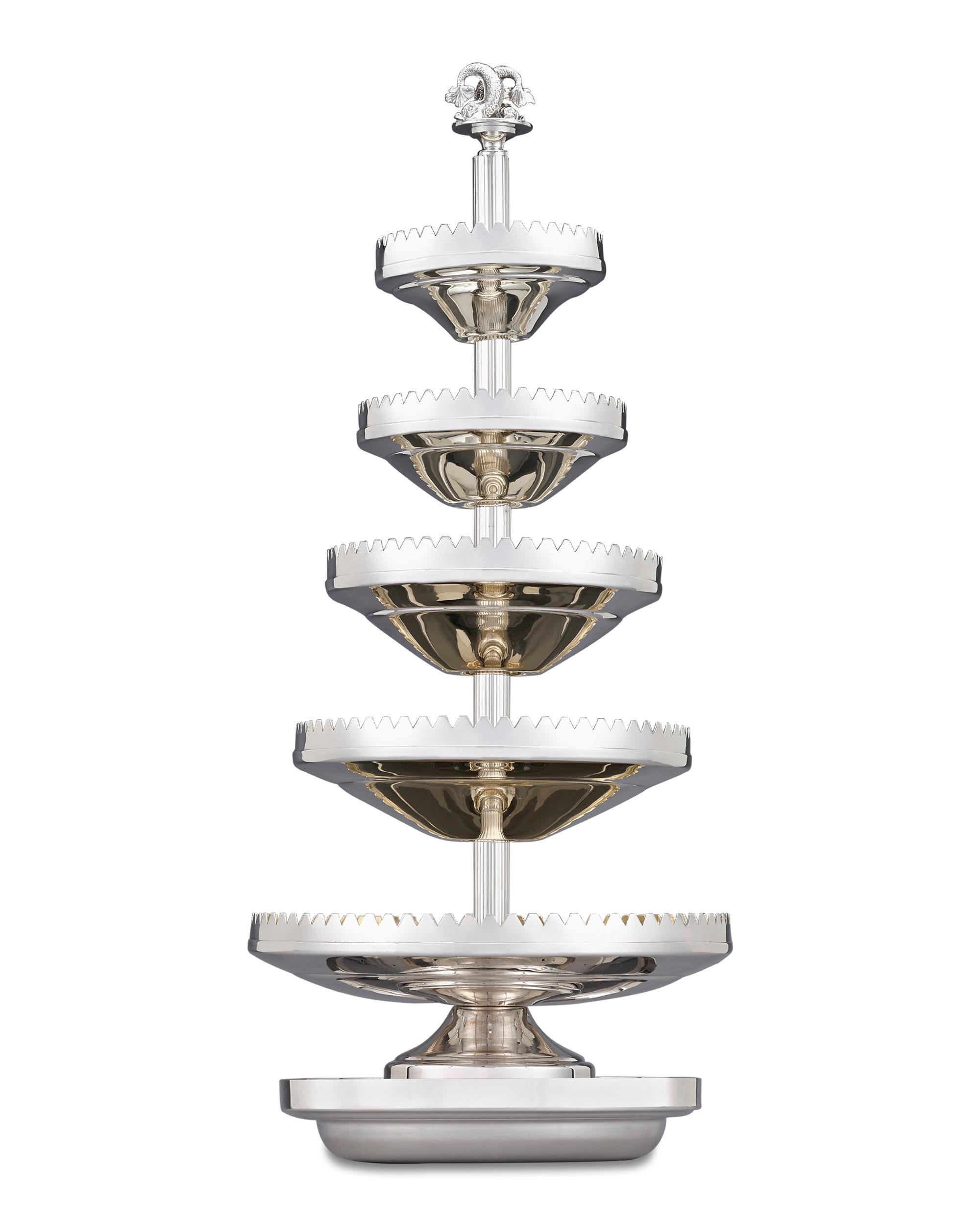 Distinguished by an impressive provenance, this outstanding five-tier silver oyster server is perfectly suited for the serving of oysters and other cocktail delicacies while keeping them chilled. This elegant service was crafted by the respected