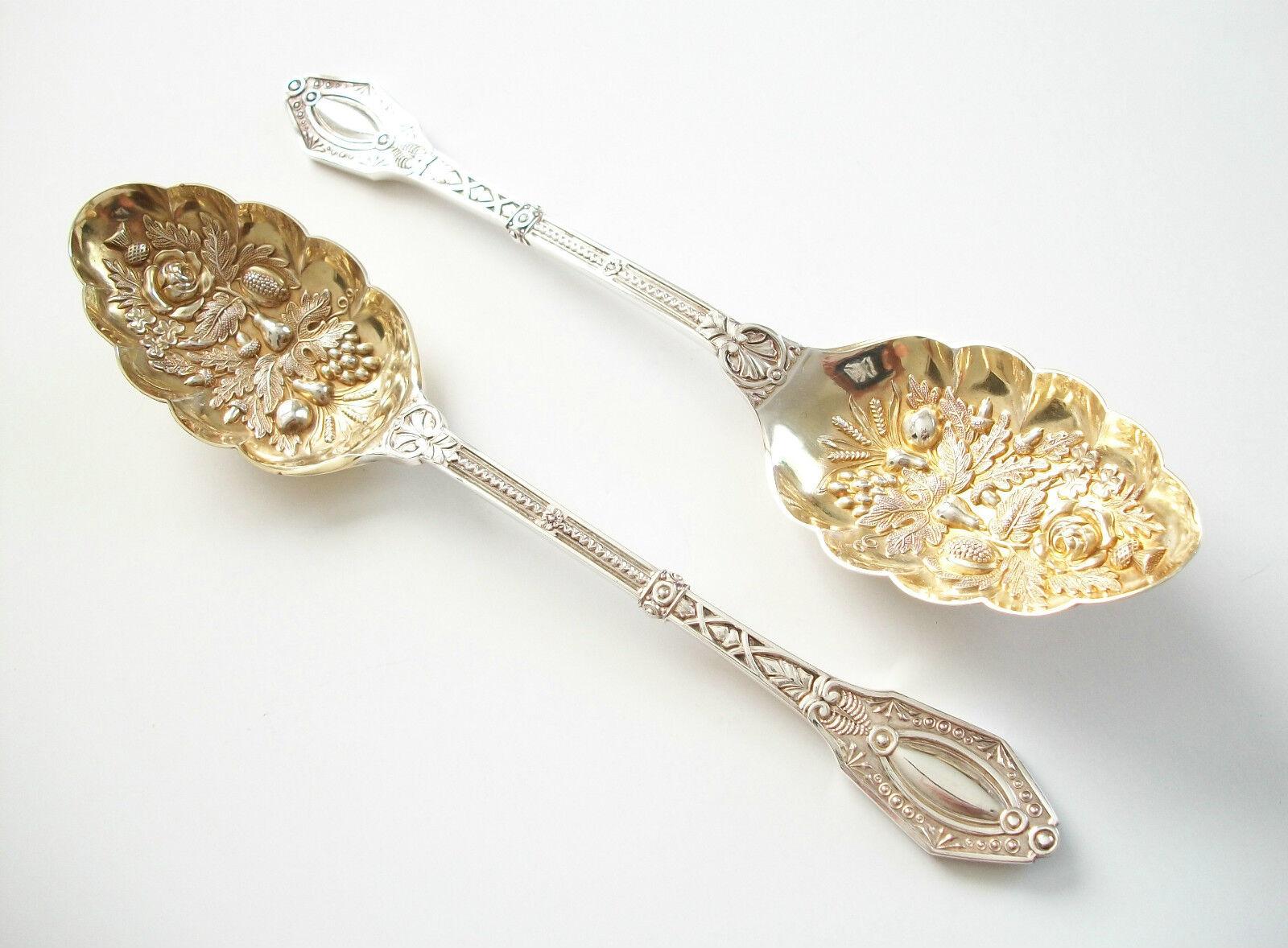 Antique - Victorian silver plate berry serving spoons - gold wash to each finely detailed and tooled bowl - contained in their original silk and velvet lined tooled leather bound case - unsigned - Victorian registration marks to each handle - U.K. -