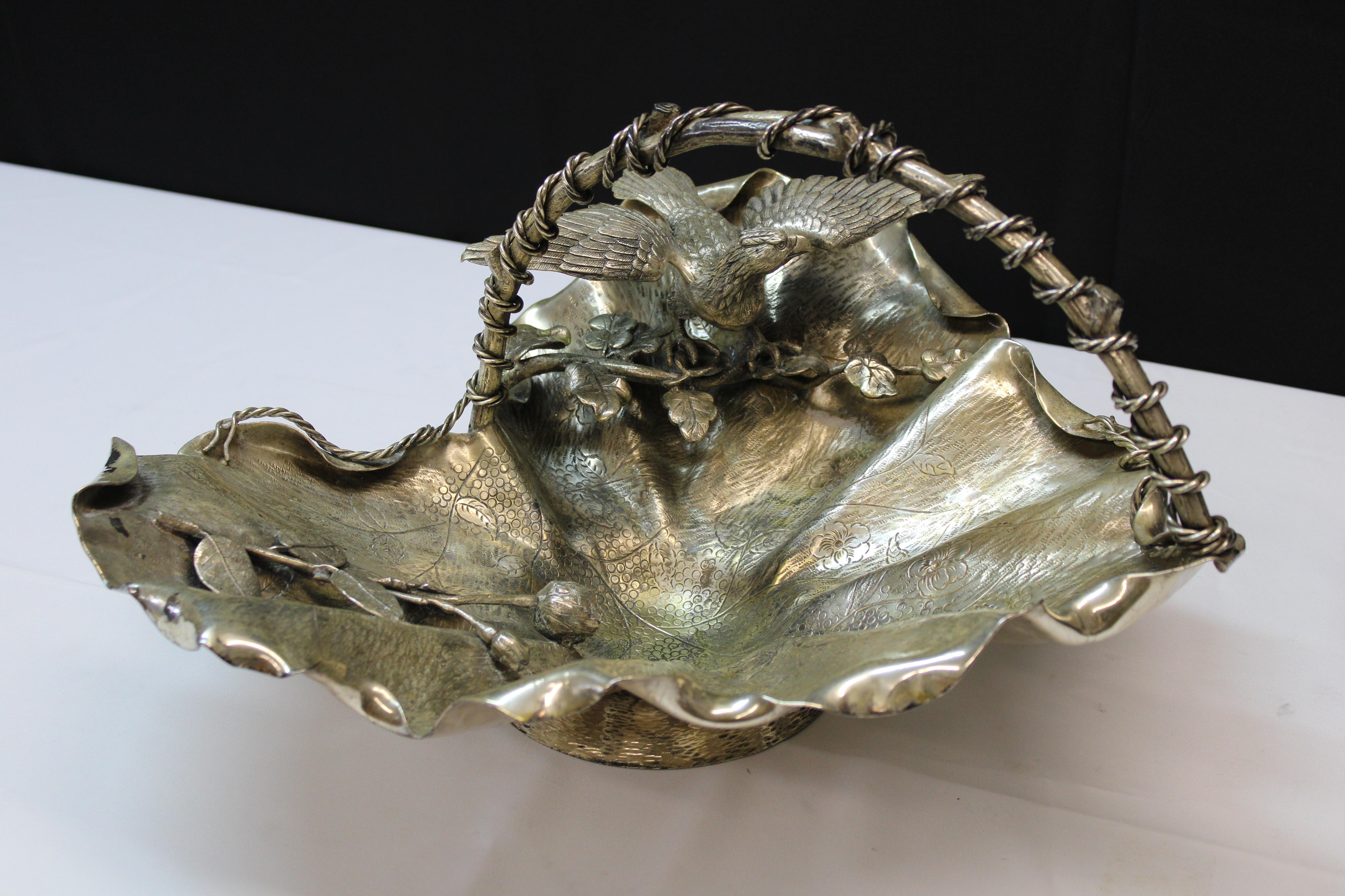Victorian silver-plate handled fruit basket decorated with flowers and eagle, heart-shaped.