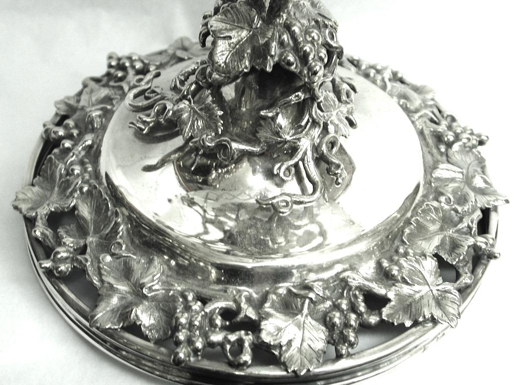 Victorian silver plated and cut frosted glass grape stand.
Made by Elkington & Co of Birmingham, circa 1850
Cast grape and vine borders with detachable rim on top of the cut glass bowl.
The cut glass is also frosted with a diamond