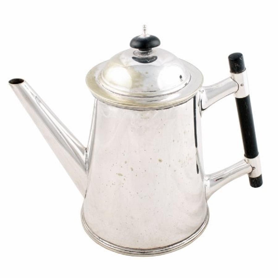 A large mid 19th century Victorian electroplated tea pot.

The tea pot has a turned ebony handle and knob to the lid, the lid pulls off and is a tight fit.


The tea pot is a tapering cylindrical shape and had a tapering spout.

The tea pot