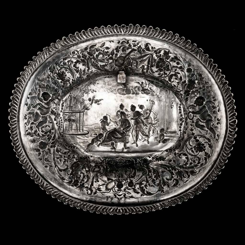 Antique 19th century early-Victorian solid silver wall plaque / sideboard dish, impressive size and weight, richly gilt, of oval form in the style of the 16th-17th century silver sideboard dishes, the border with scrolling foliage and angels,