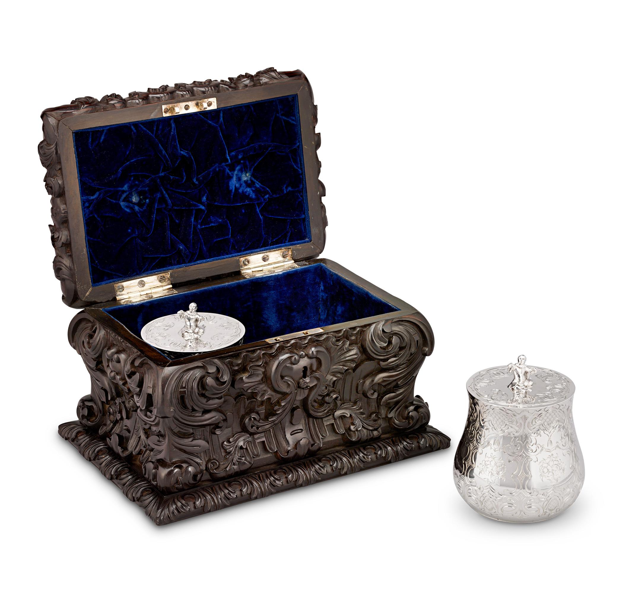 Pair of Victorian Silver Tea Caddies in a Carved Ebony Case
Charles Thomas Fox & George Fox
Hallmarked London, 1845

Reflecting the 19th century’s deep reverence for tea, this exceptional pair of Victorian silver tea caddies by Charles Thomas Fox &