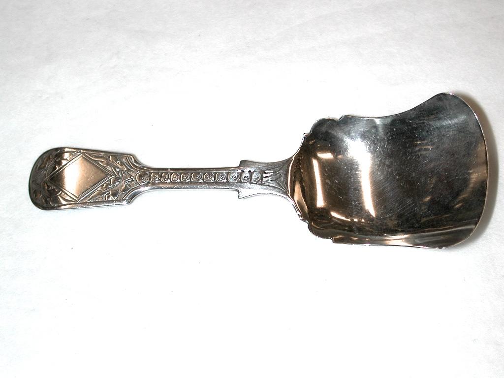 Victorian silver tea caddy spoon dated 1877, assayed in Birmingham, George Unite
Pretty shovel shaped caddy spoon with hand engraved handle.