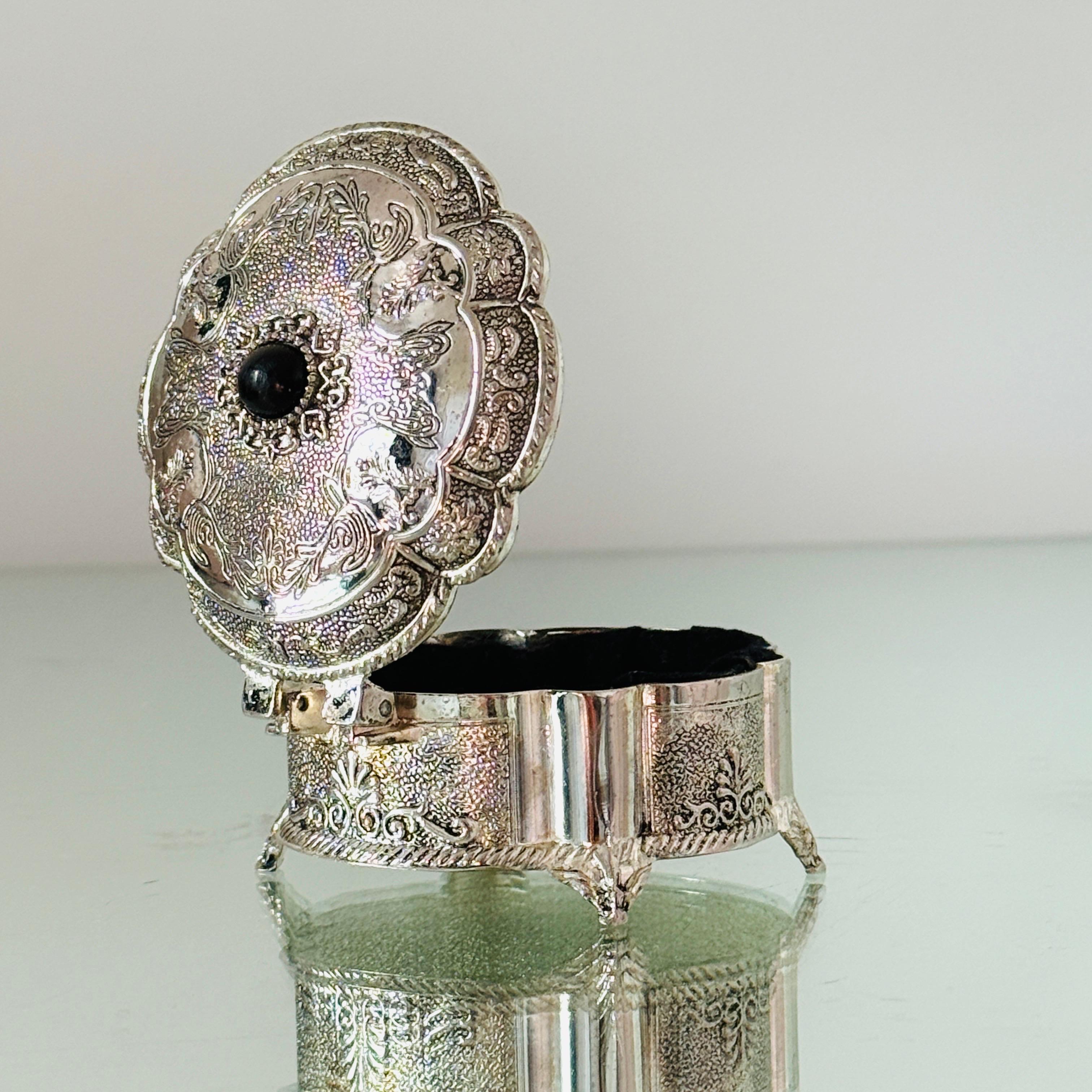 Cast Victorian Silvered Trinket Box with Engraved Designs and Onyx Stone For Sale