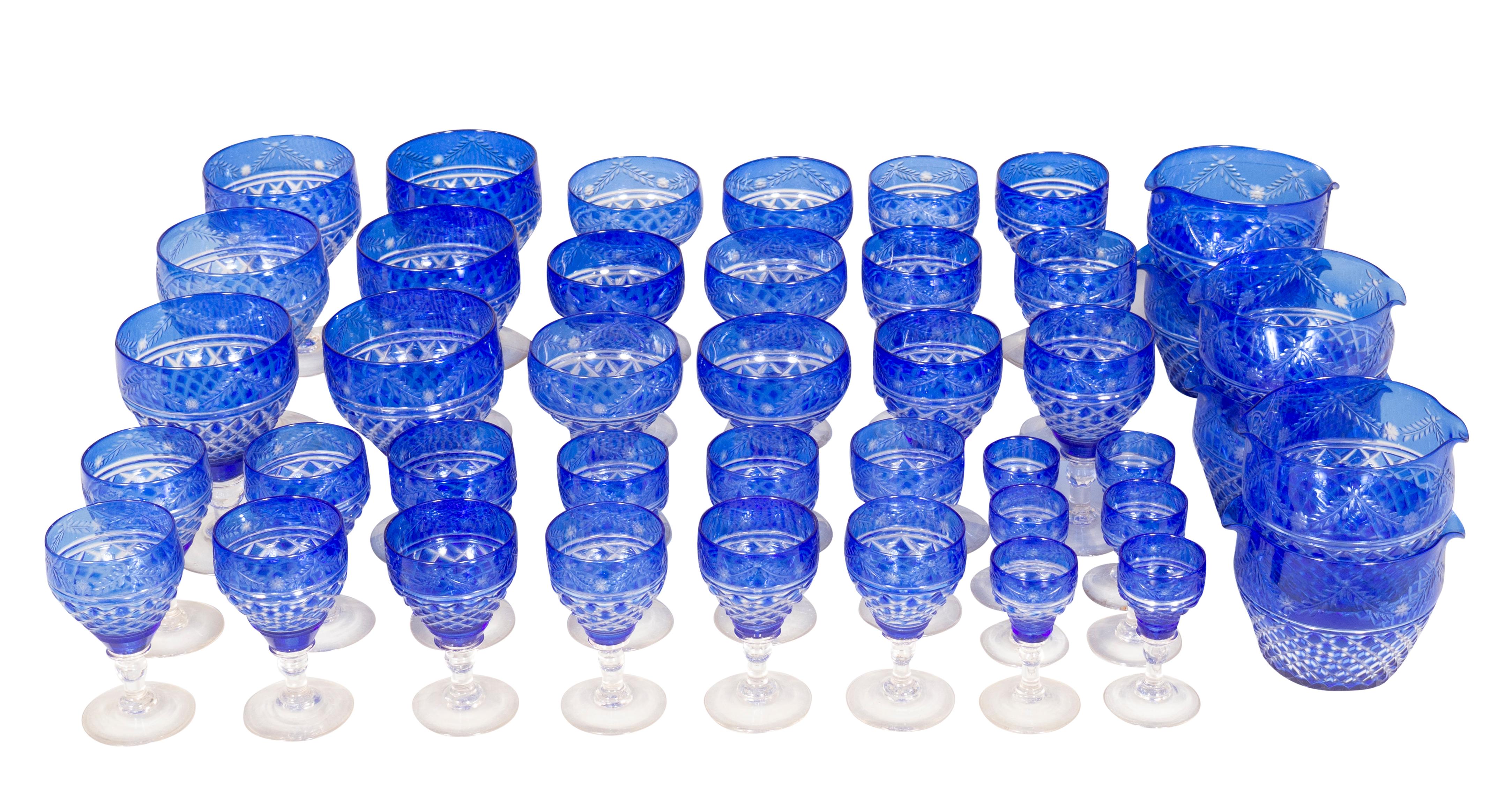 Comprising 10 water glasses, 7 wine rinsers 5.5 dia, 6 champagne, 12 small liqueurs, 11 bigger liqueurs, 14 assorted wines. Blue cut to clear with cross hatch cut.