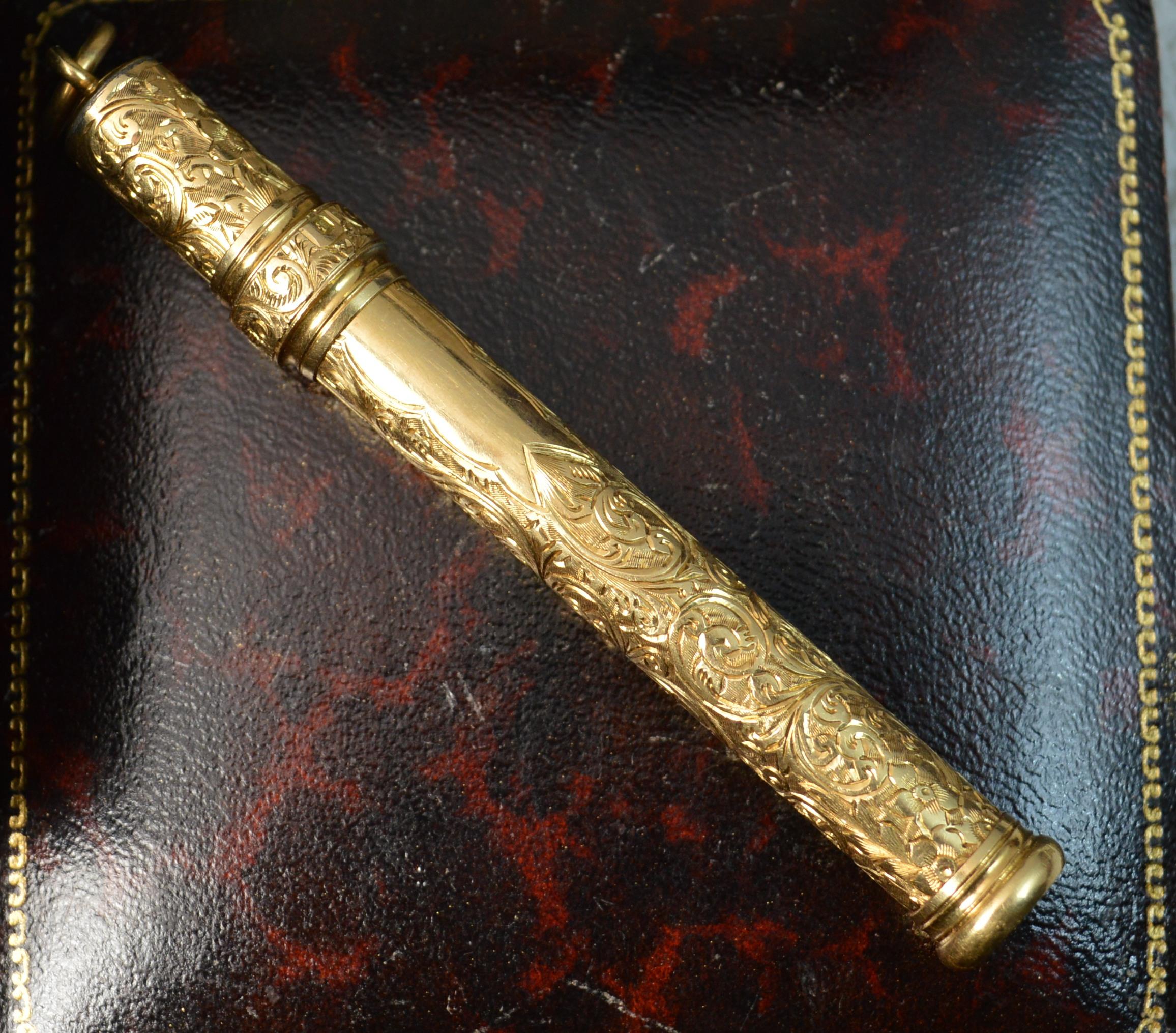 A stunning English late Victorian era propelling pencil.
Solid 18 carat yellow gold example.
Very fine hand engraved floral design throughout with a plain cartouche.
CONDITION ; Excellent. Very crisp design and engraving throughout. Extends well.